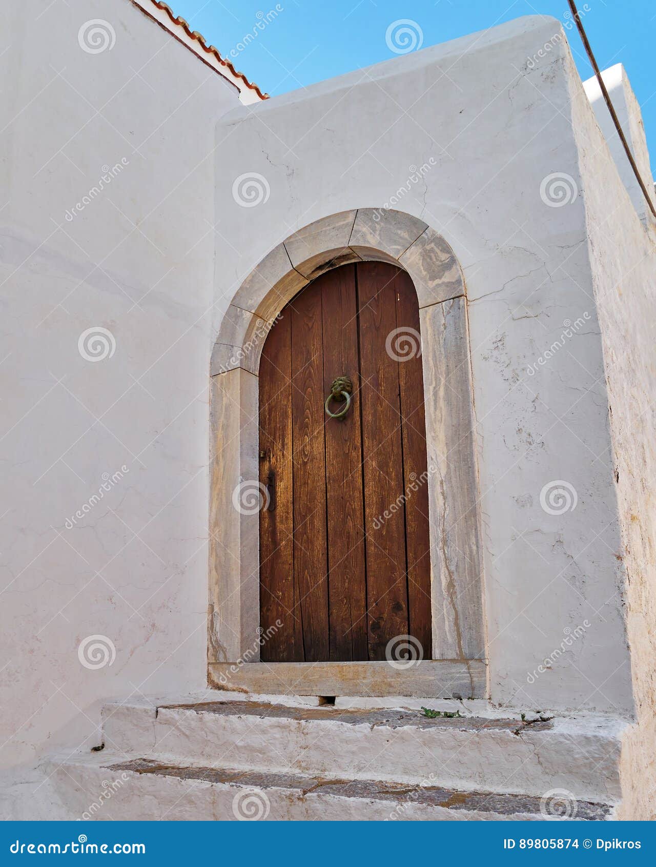 Brown door on white wall stock photo. Image of home, solid 89805874