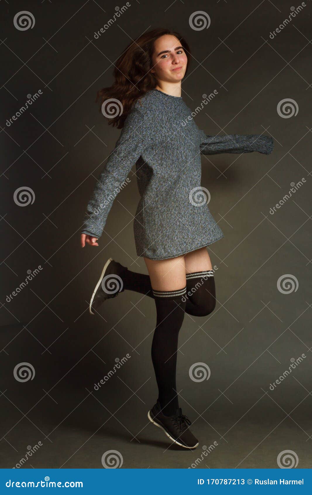 The Brown-haired Girl in Grey Short Dress, Black Sneakers Courtesans, a Life-size Portrait on a Dark Gray Studio Background Stock Image - Image of background, frame: 170787213 The Brown-haired Girl in Grey Short Dress, Black Sneakers Courtesans, a Life-size Portrait on a Dark Gray Studio Background Stock Image - Image of background, frame: 170787213