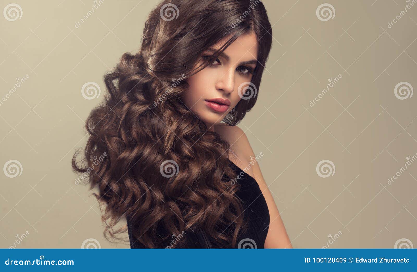 Brown Haired Woman With Voluminous Shiny And Curly