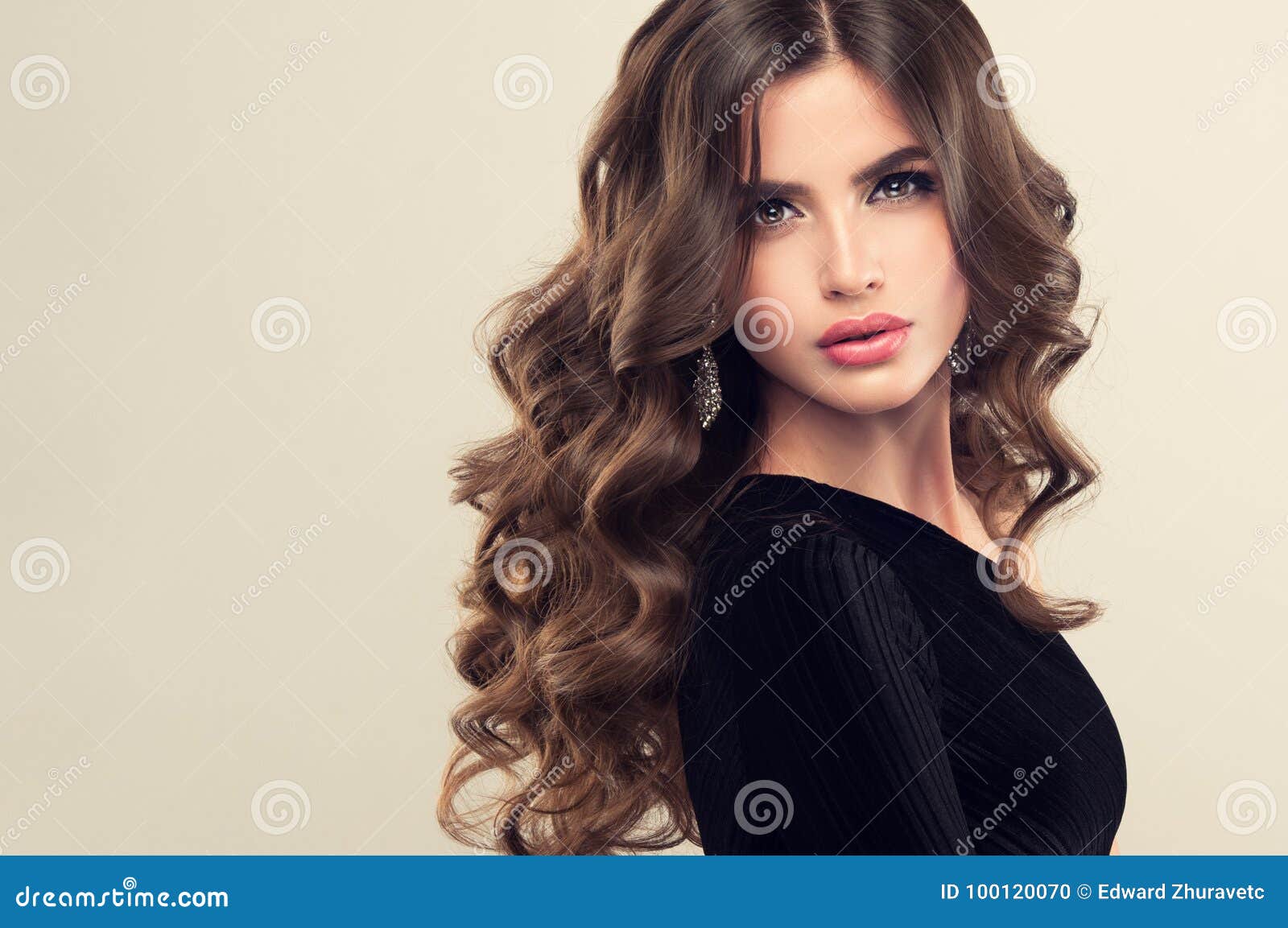 Brown Haired Woman With Voluminous Shiny And Curly