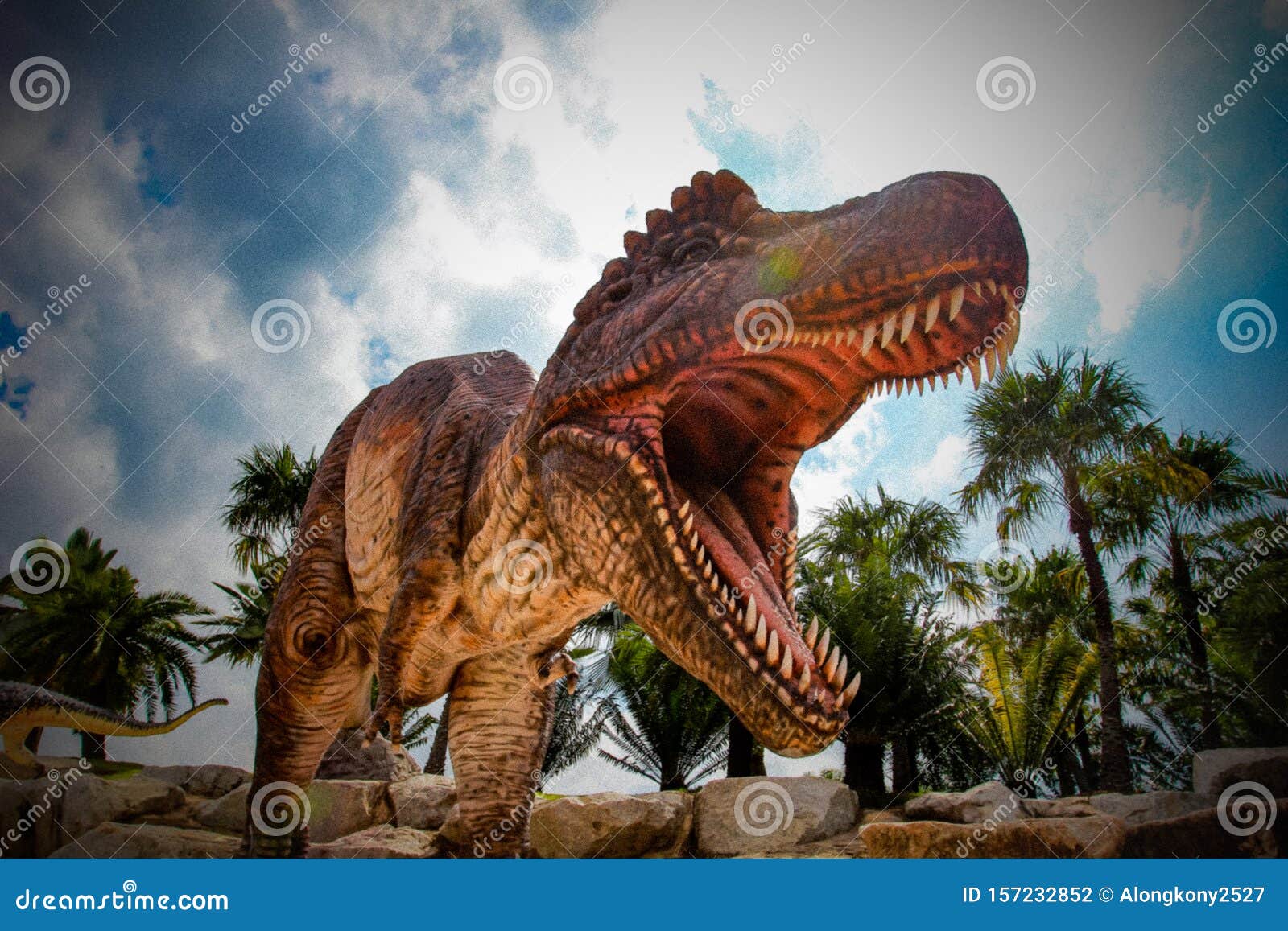 Huge Dinosaur Statue on the Rock Stock Photo Image of green, color