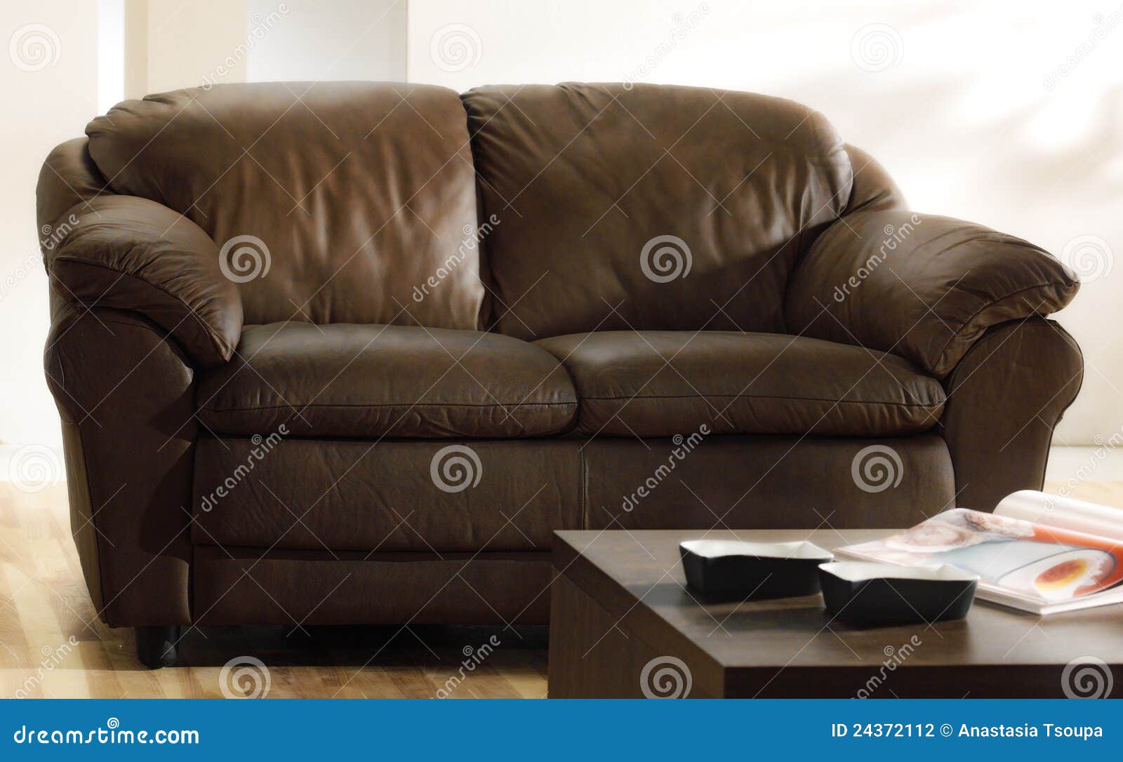 brown leather couch and table