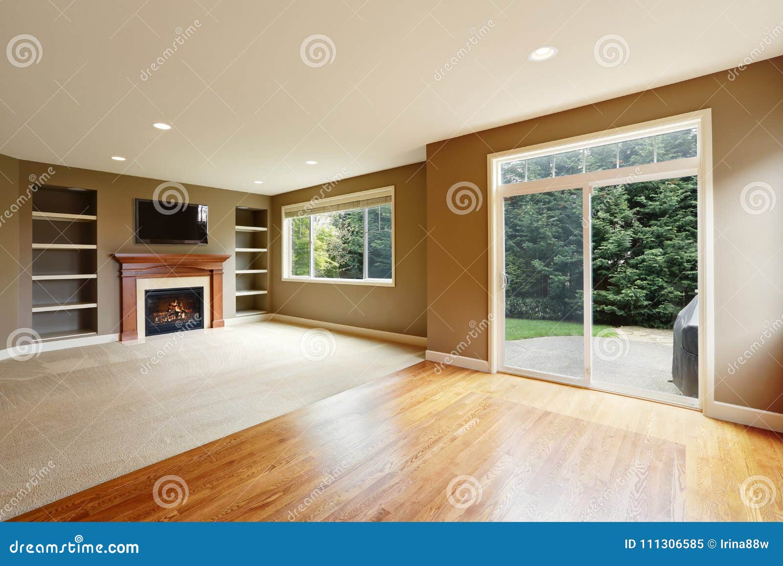Brown Living Room Interior With Fireplace And Bookshelves Stock