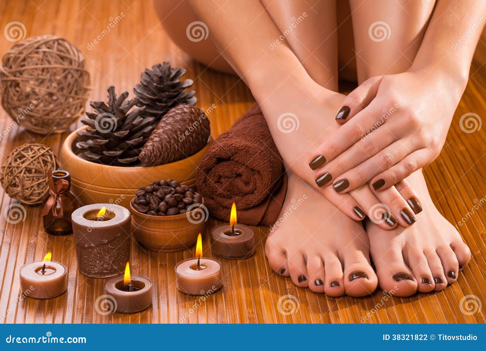 brown manicure and pedicure on the white