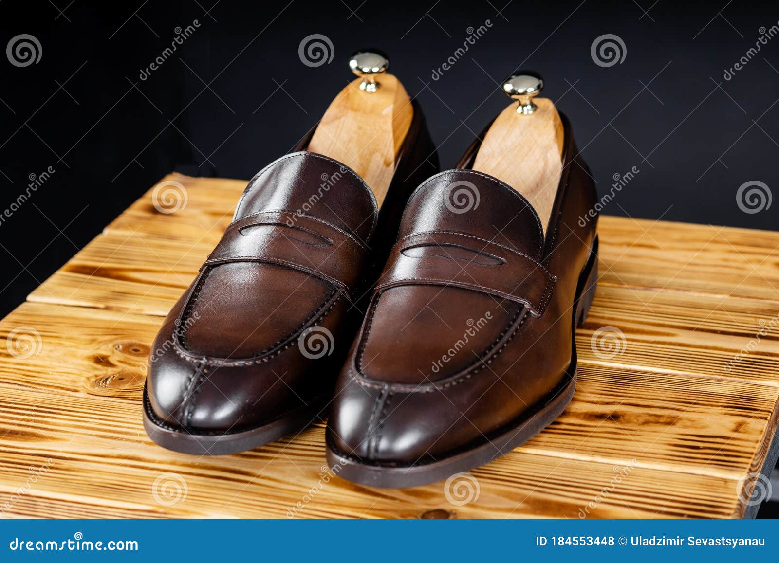 Brown Men`s Loafers with a Black Sole Over Black Background Stock Photo ...