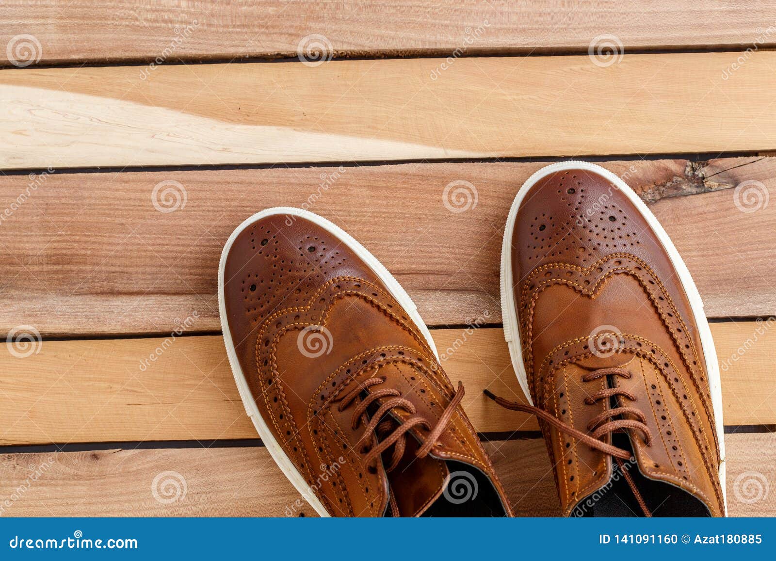 Download Brown Mens Shoes On Wooden Background. Top View Stock ...