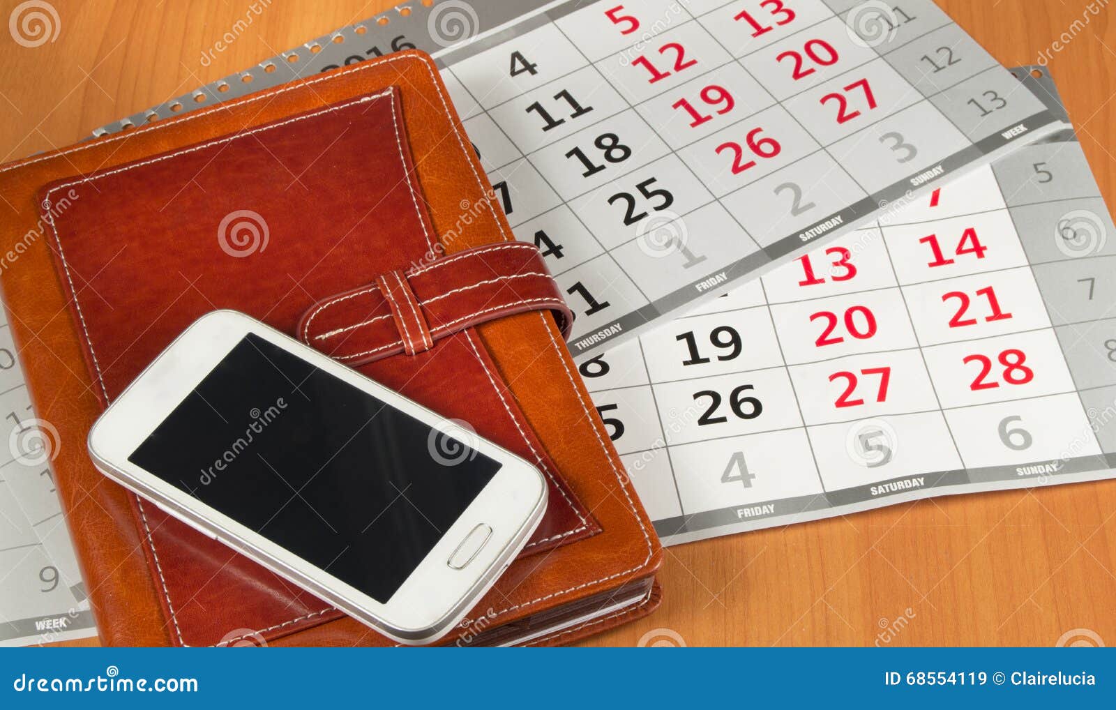 Brown Personal Organizer or Planner with a Mobile Phone and a Calendar