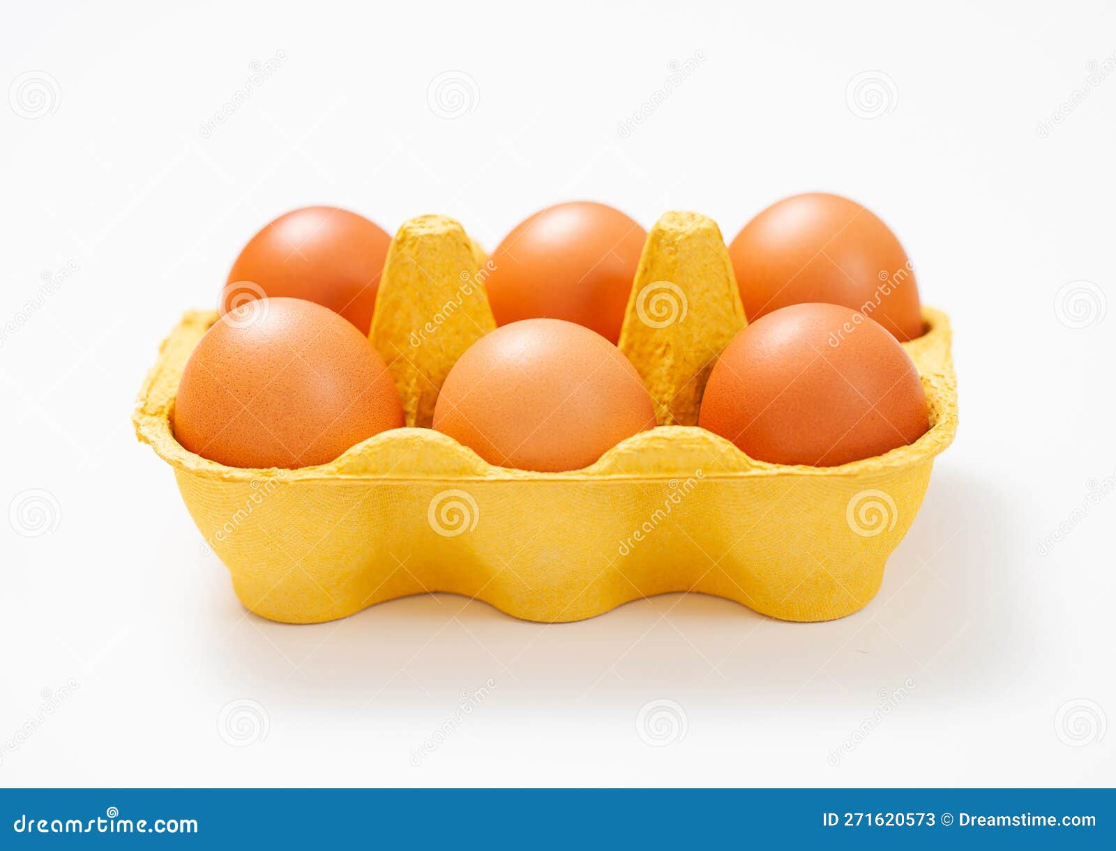 Brown Raw Organic Eggs in Yellow Paper Tray on White Background Stock