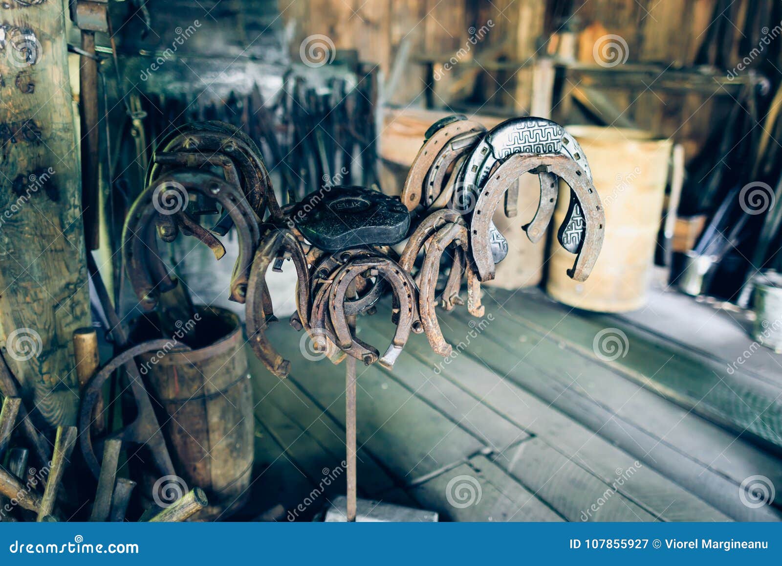 Brown Rusty Antique Horseshoes In A Barn Hooked Into The Nail