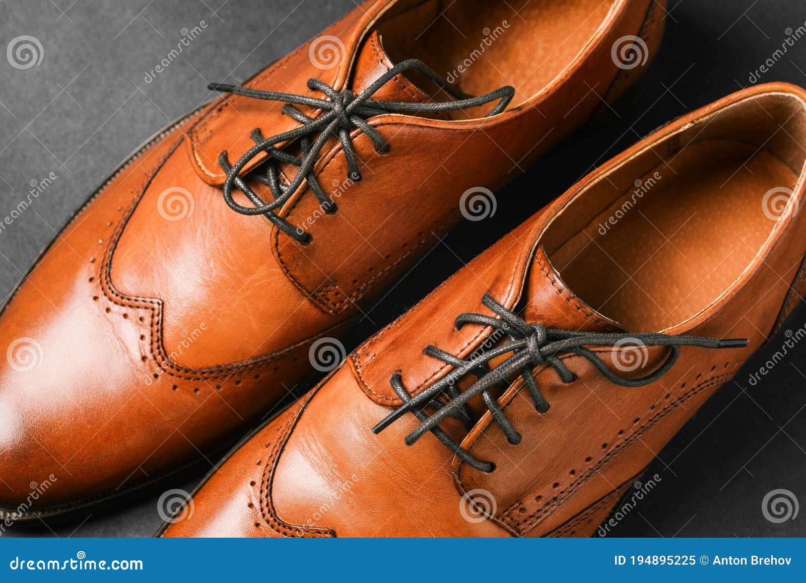 Brown Shoes Close-up on a Black Background. Classic Men`s Shoes Made of ...