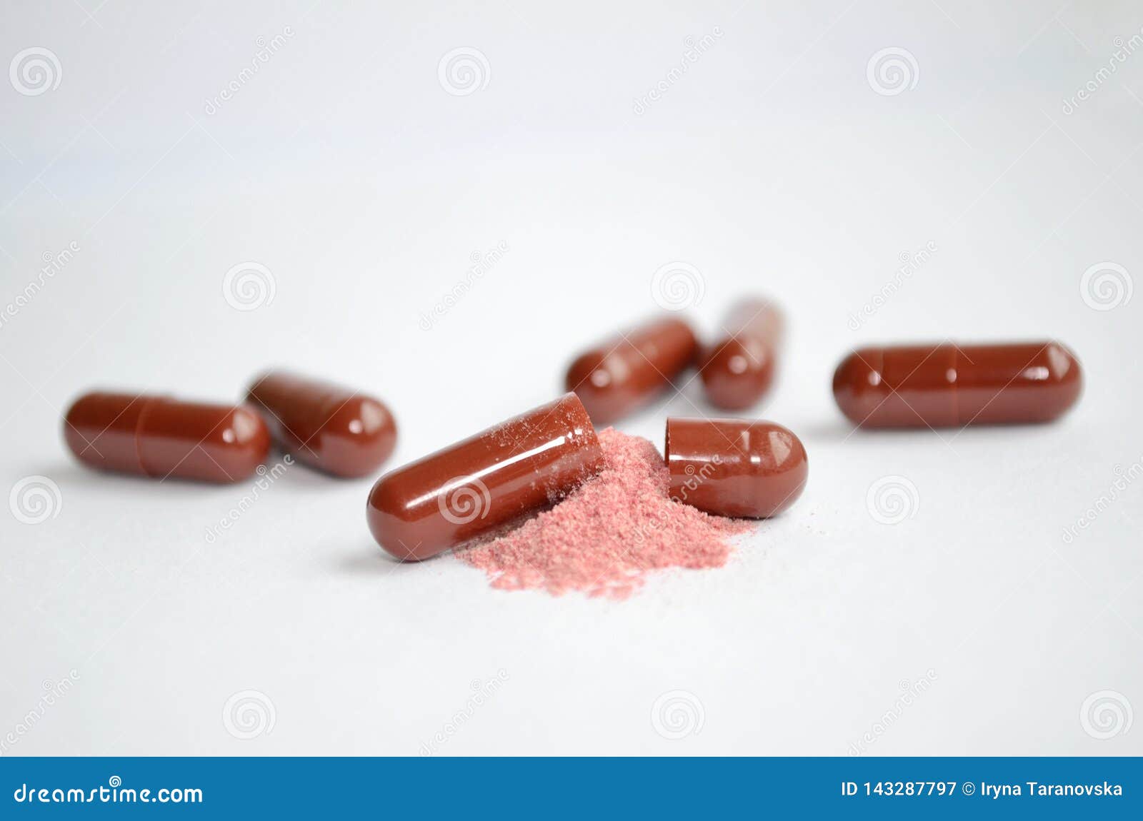 Brown Tablets, Gelatin Capsules, One of Them is Open and with the