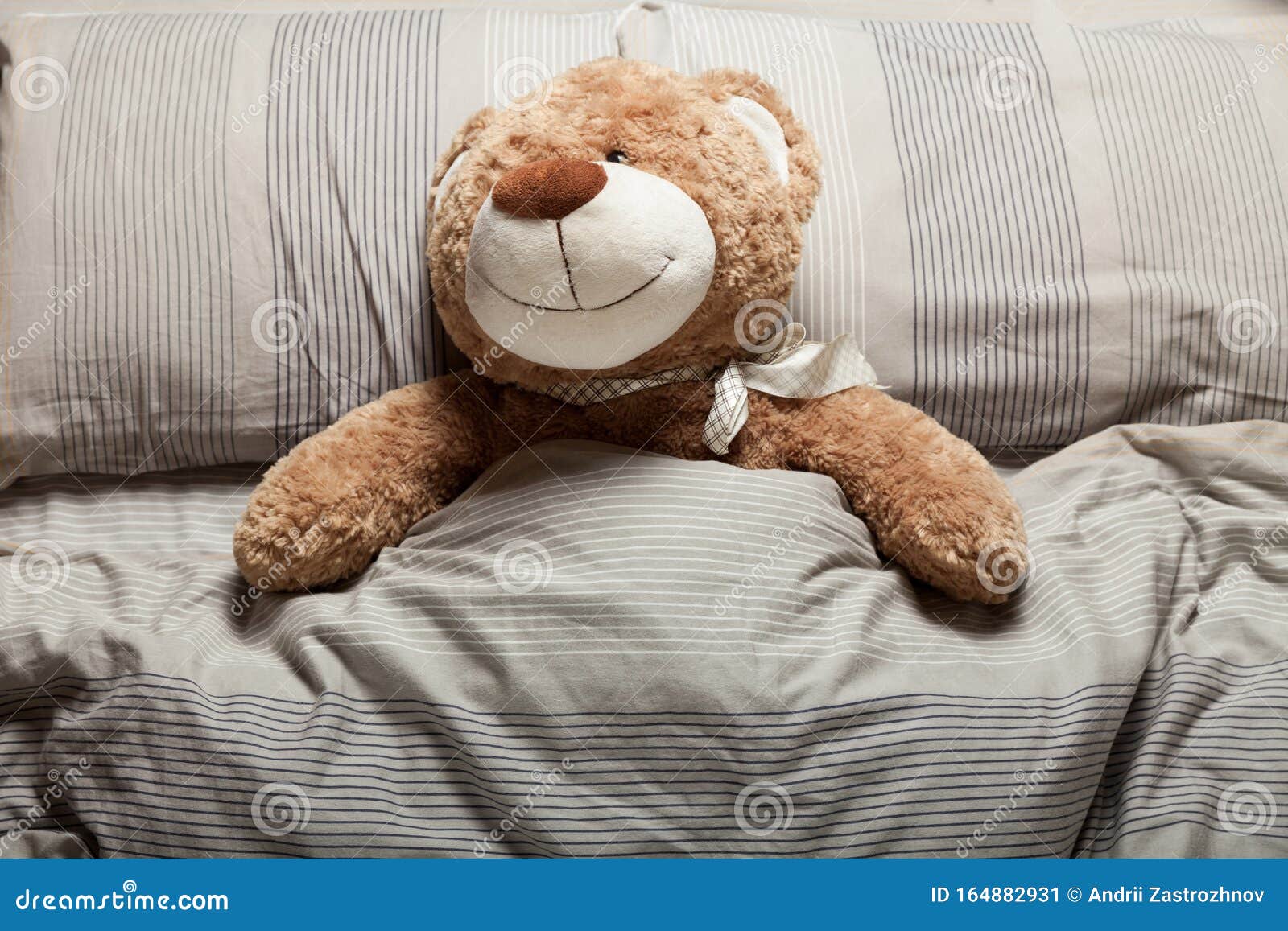 Is Sleeping With A Teddy Bear Haram Brown Teddy Bear Laying in Bed, Furry Doll. Sweet Sleep Stock Image