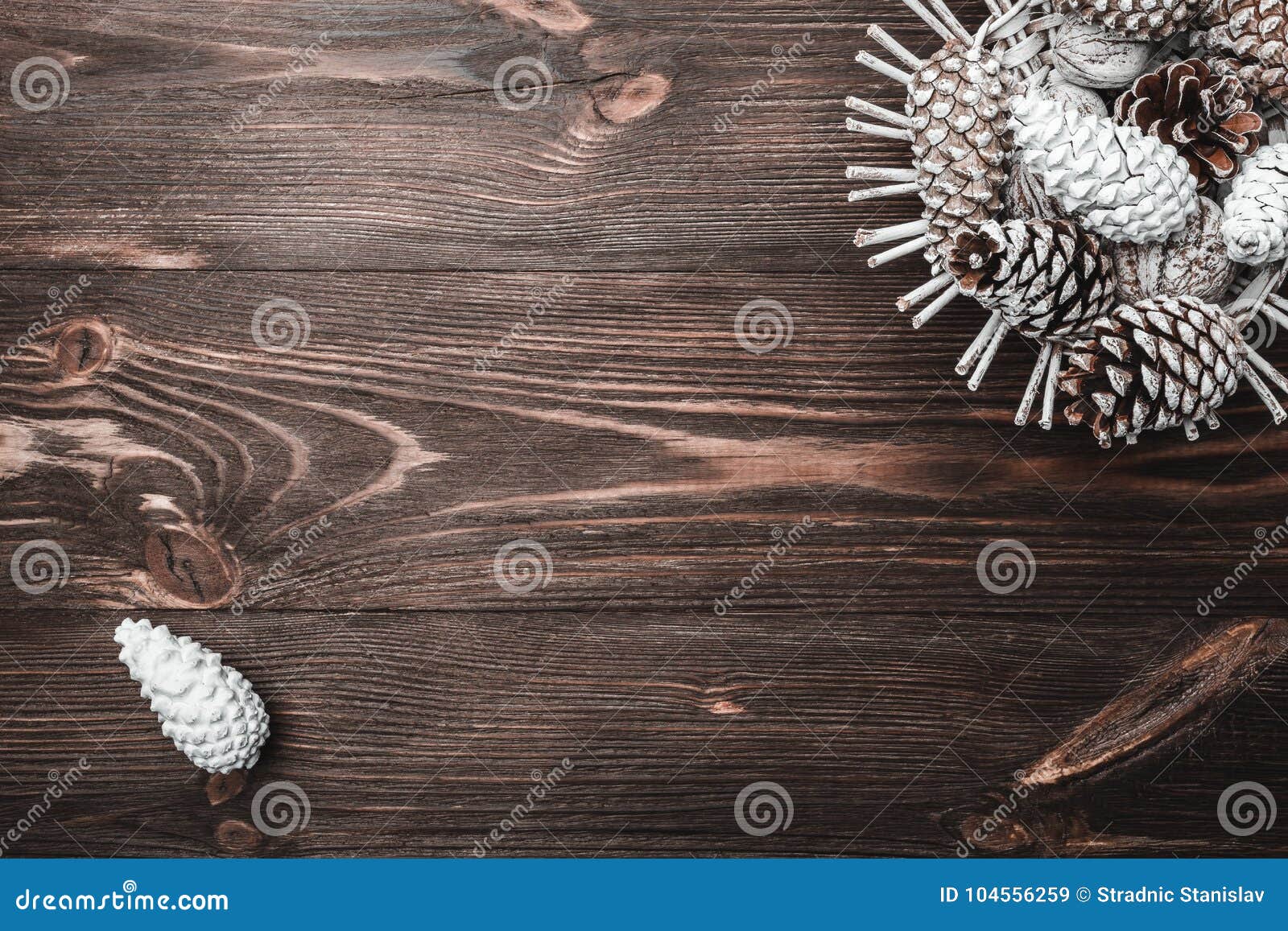 brown wood background with texture. decorative fir cones. fellowship, new year and xmas.