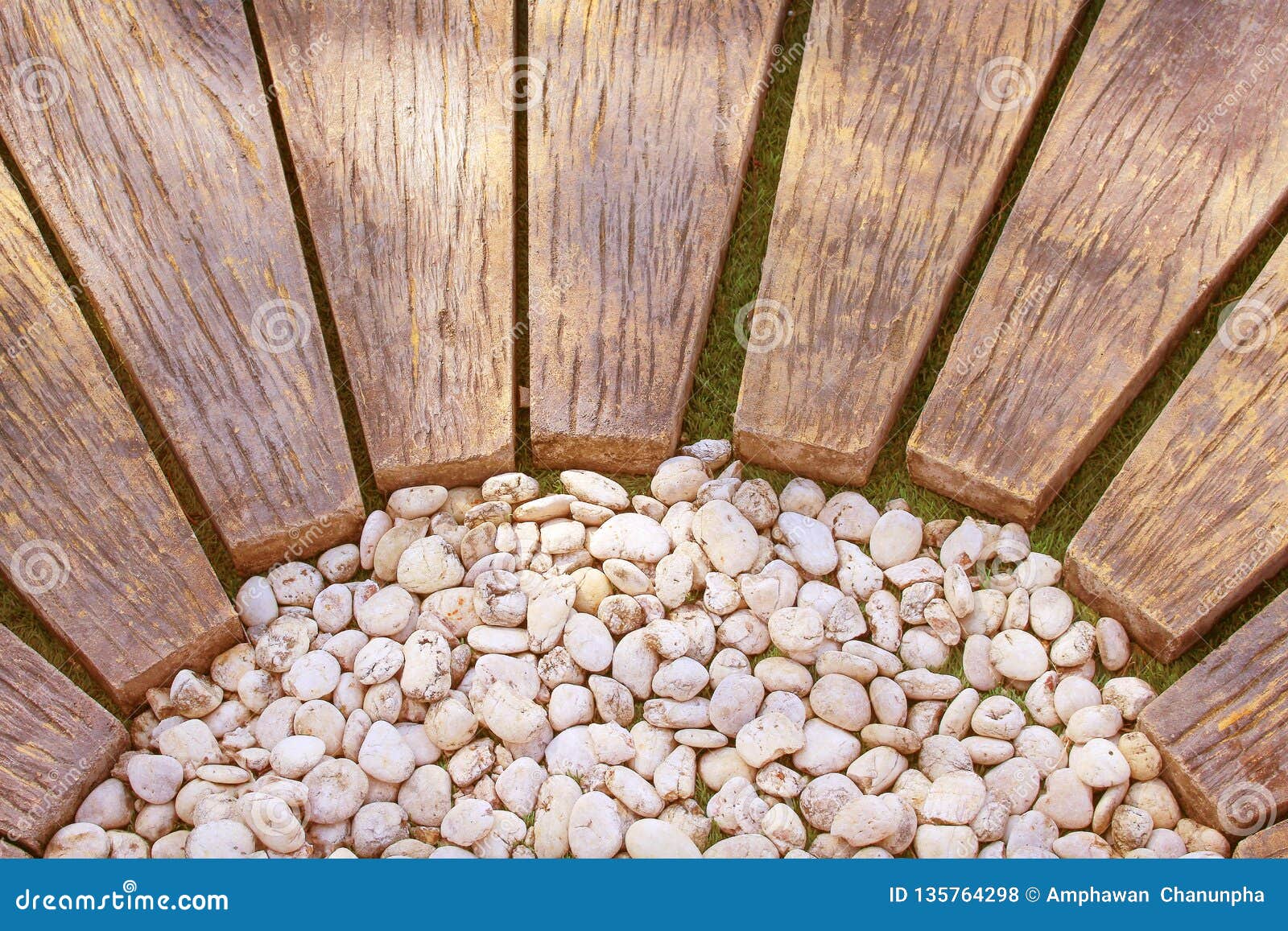 Brown Wood Walkway With White Small Rocks Pattern In The Garden