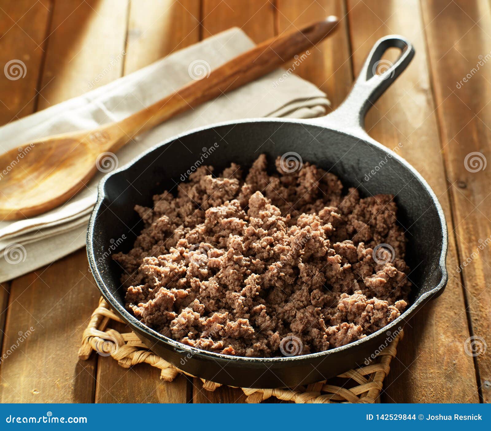 browned ground beef in cast iron skillet