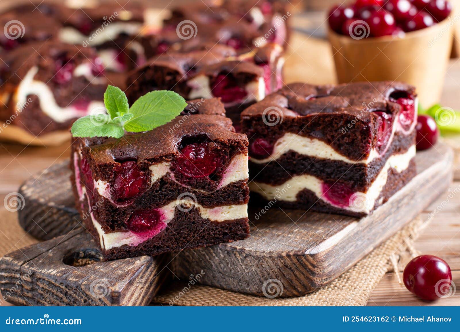 Brownie with Cottage Cheese and Cherries on Wooden Table Stock Photo