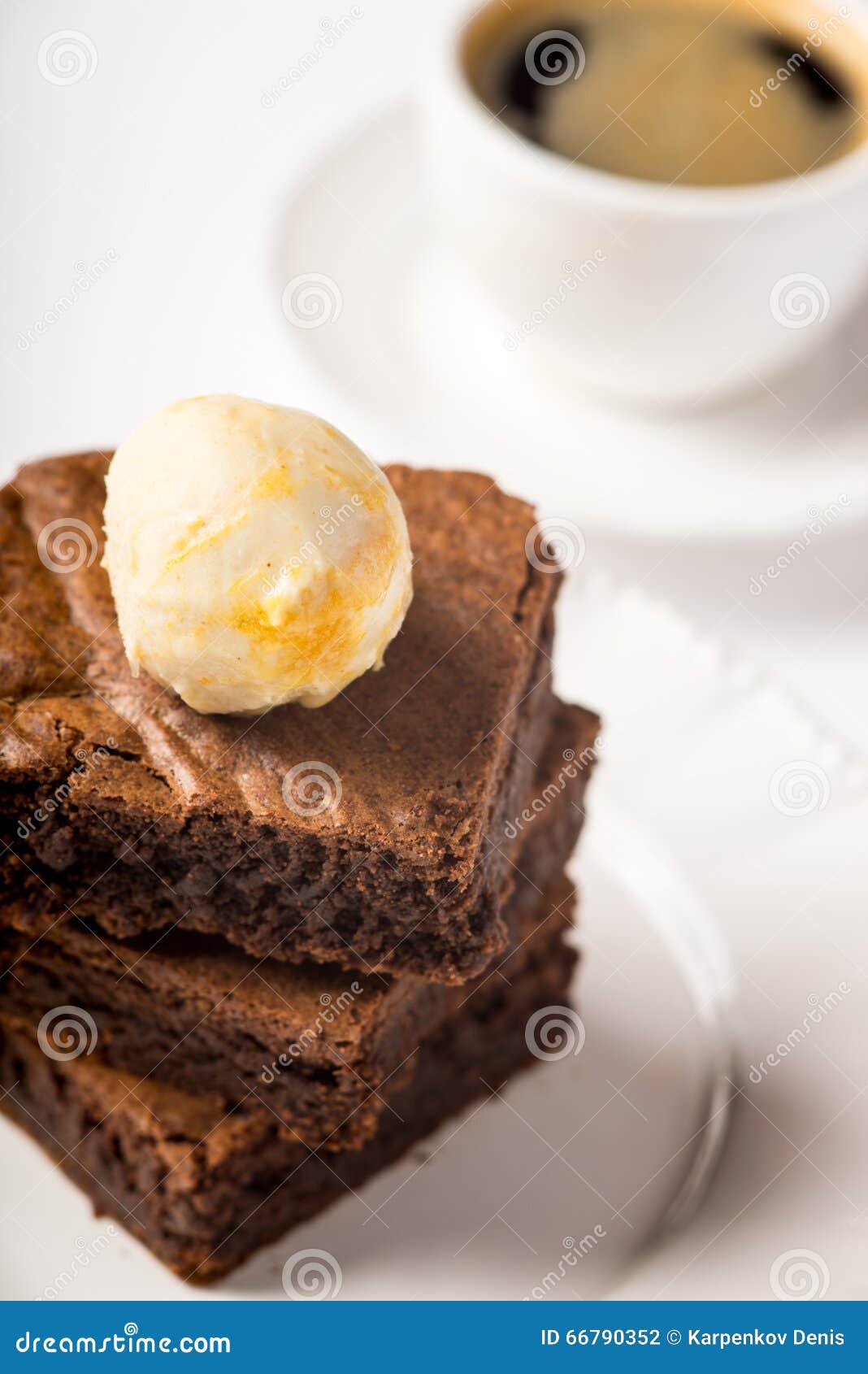 Brownie with Ice Cream and a Cup of Coffee on the Table Stock Photo