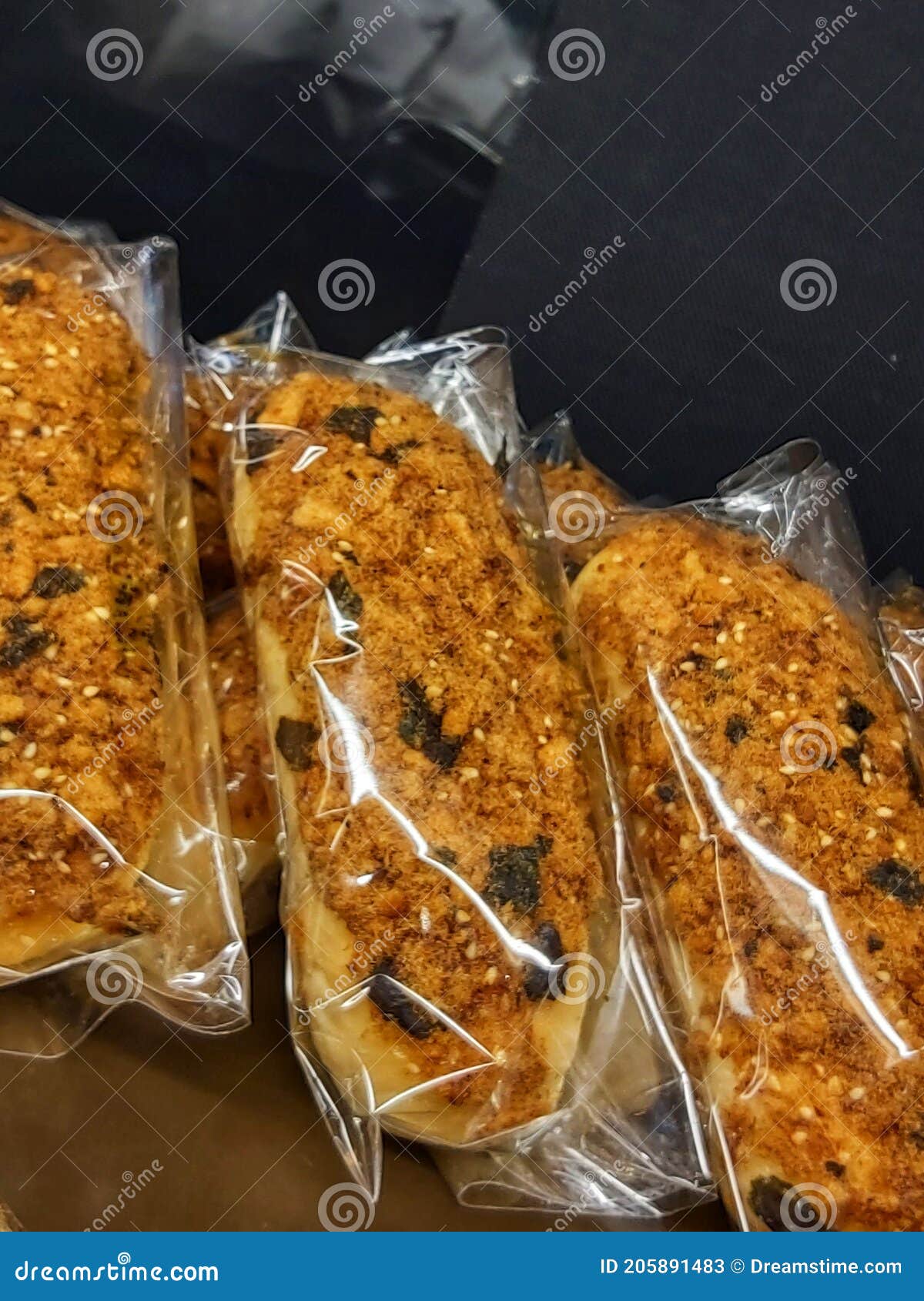 Brownish Colored Bread with a Topping on Top of Shredded Beef in the