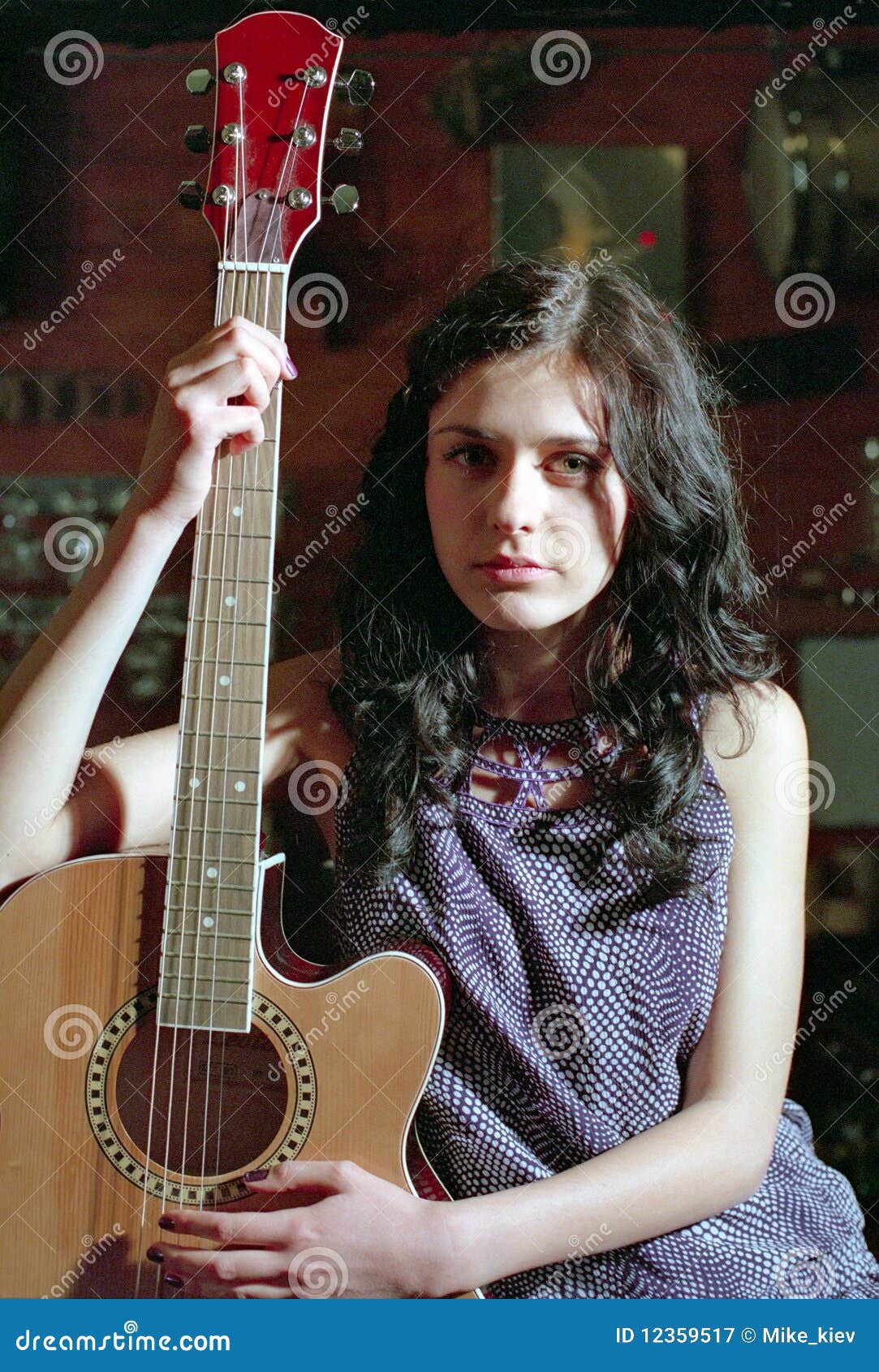 brunet woman with guitar