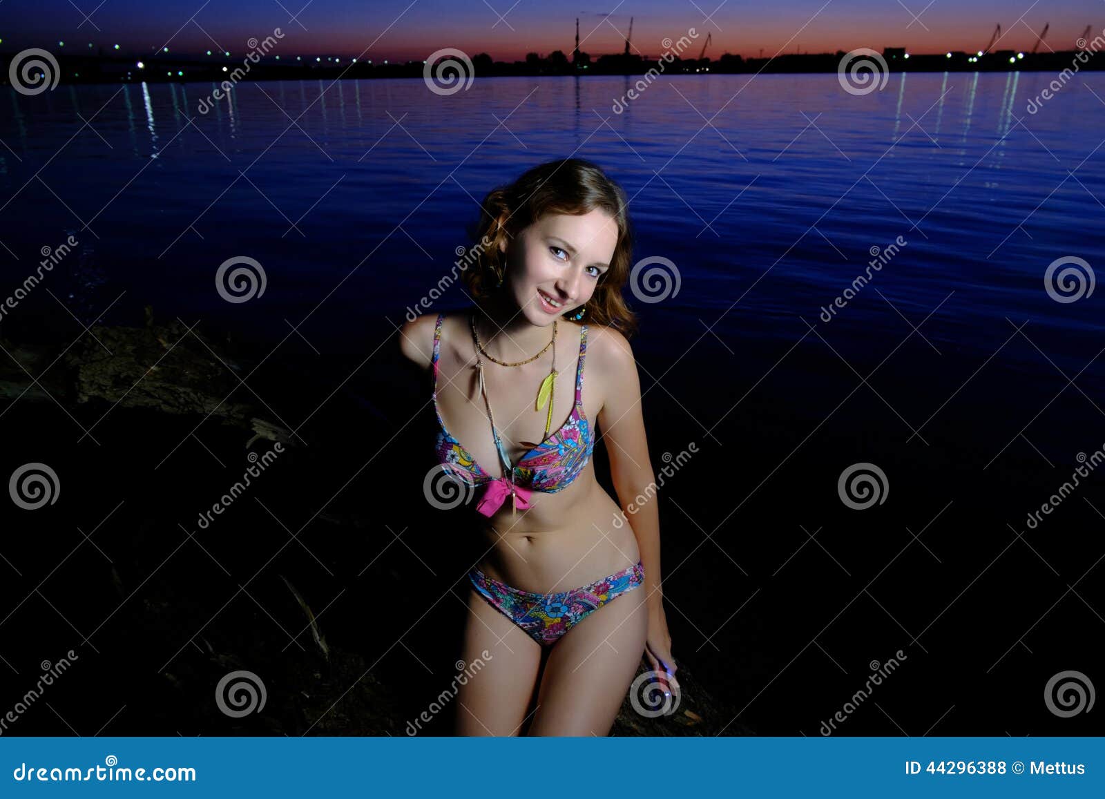 A Brunette Bikini Model Posing on a Beach. Stock Photo - Image of