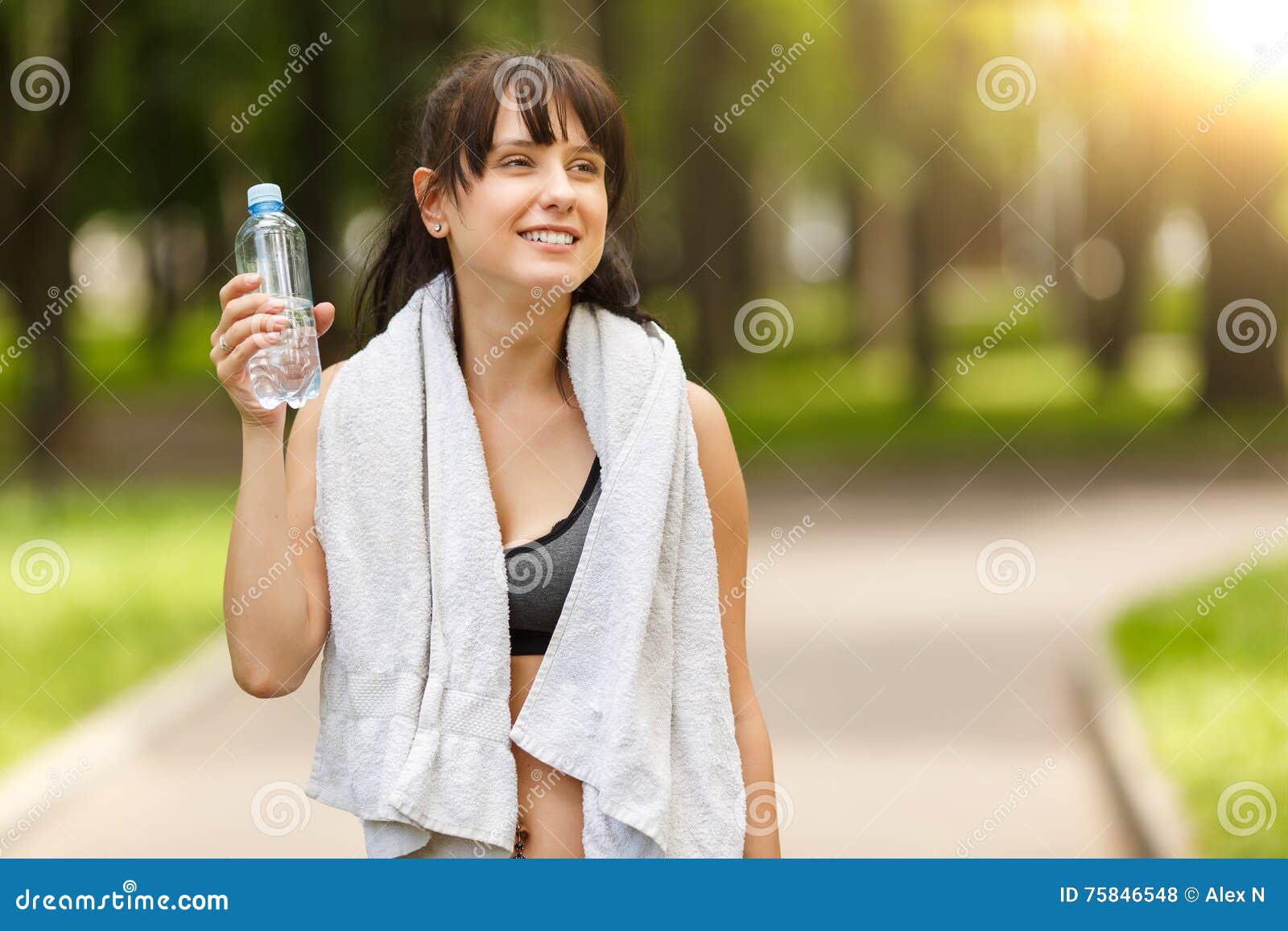 Brunette Girl Holding Bottle of Water after Sport in Park Stock Photo ...