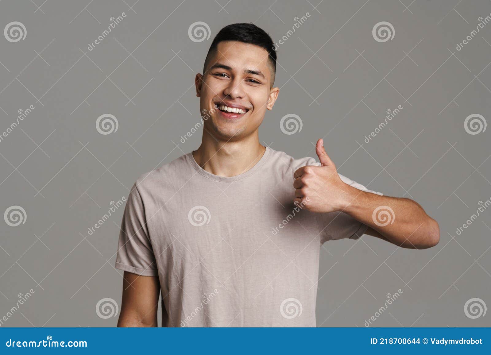 Brunette Happy Man Smiling and Showing Thumb Up at Camera Stock Photo ...