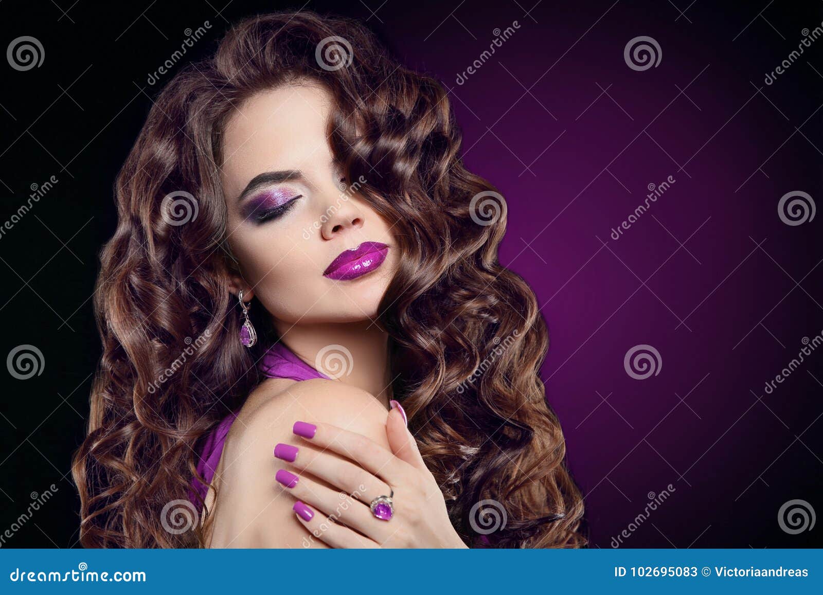 brunette with long curly hair, violet makeup, manicure nails, am