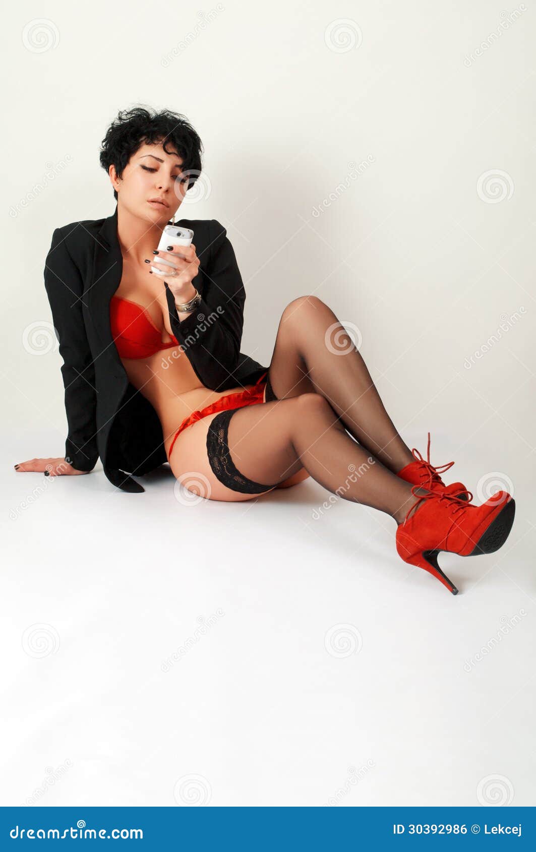 Brunette In Red With Smartphone Royalty Free Stock Image Image 30392986