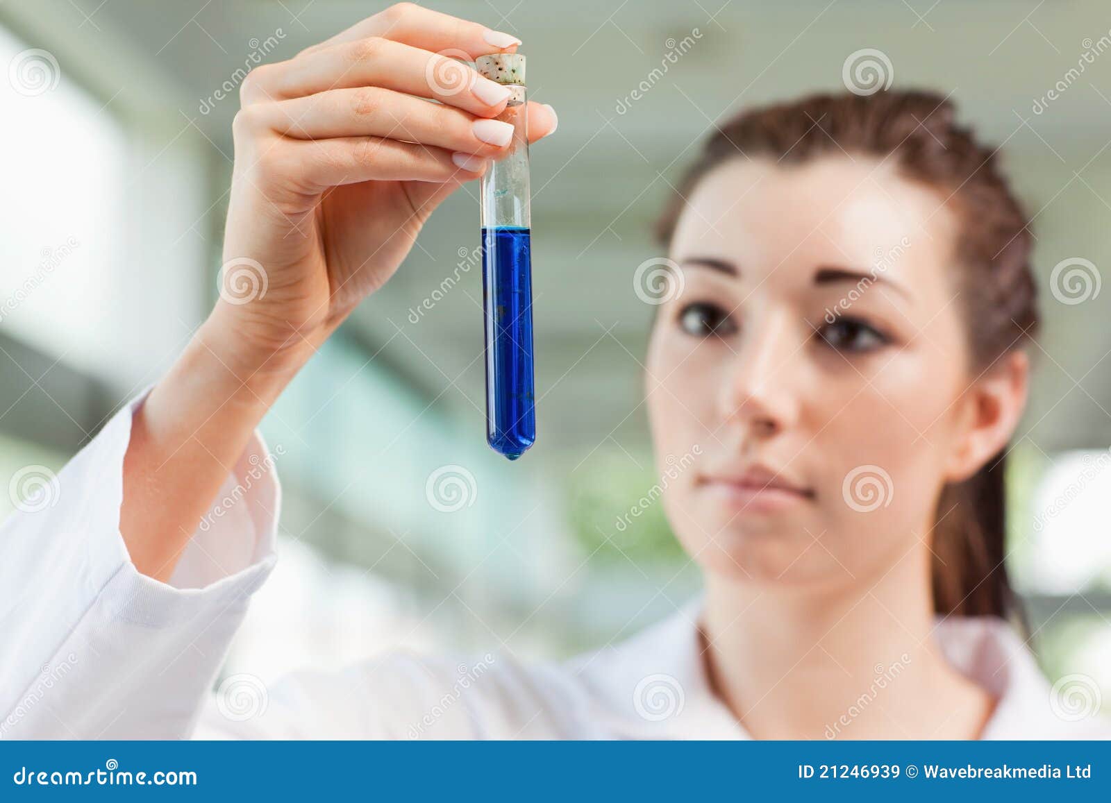 Brunette Scientist Looking At A Test Tube Royalty Free