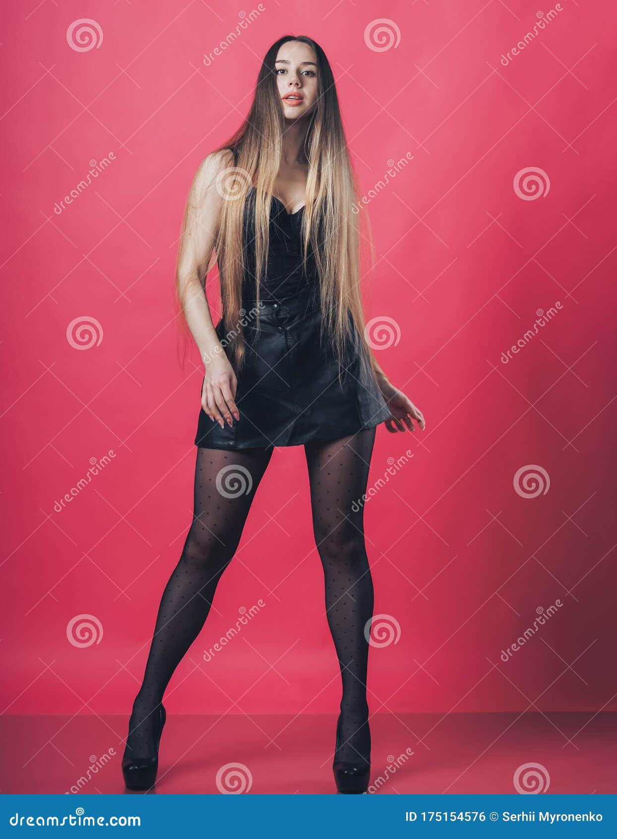 Brunette Girl Posing at the Pink Background Stock Photo - Image of ...