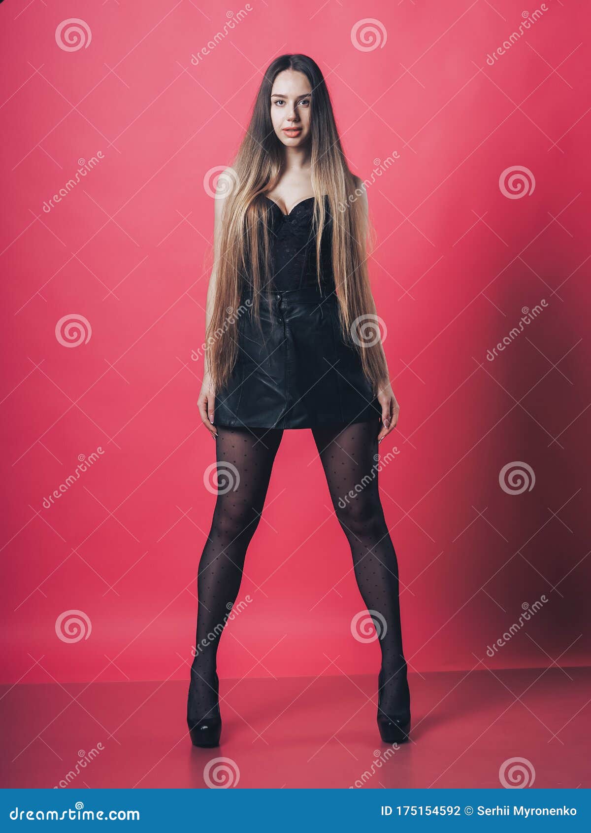 Brunette Girl Posing at the Pink Background Stock Photo - Image of ...