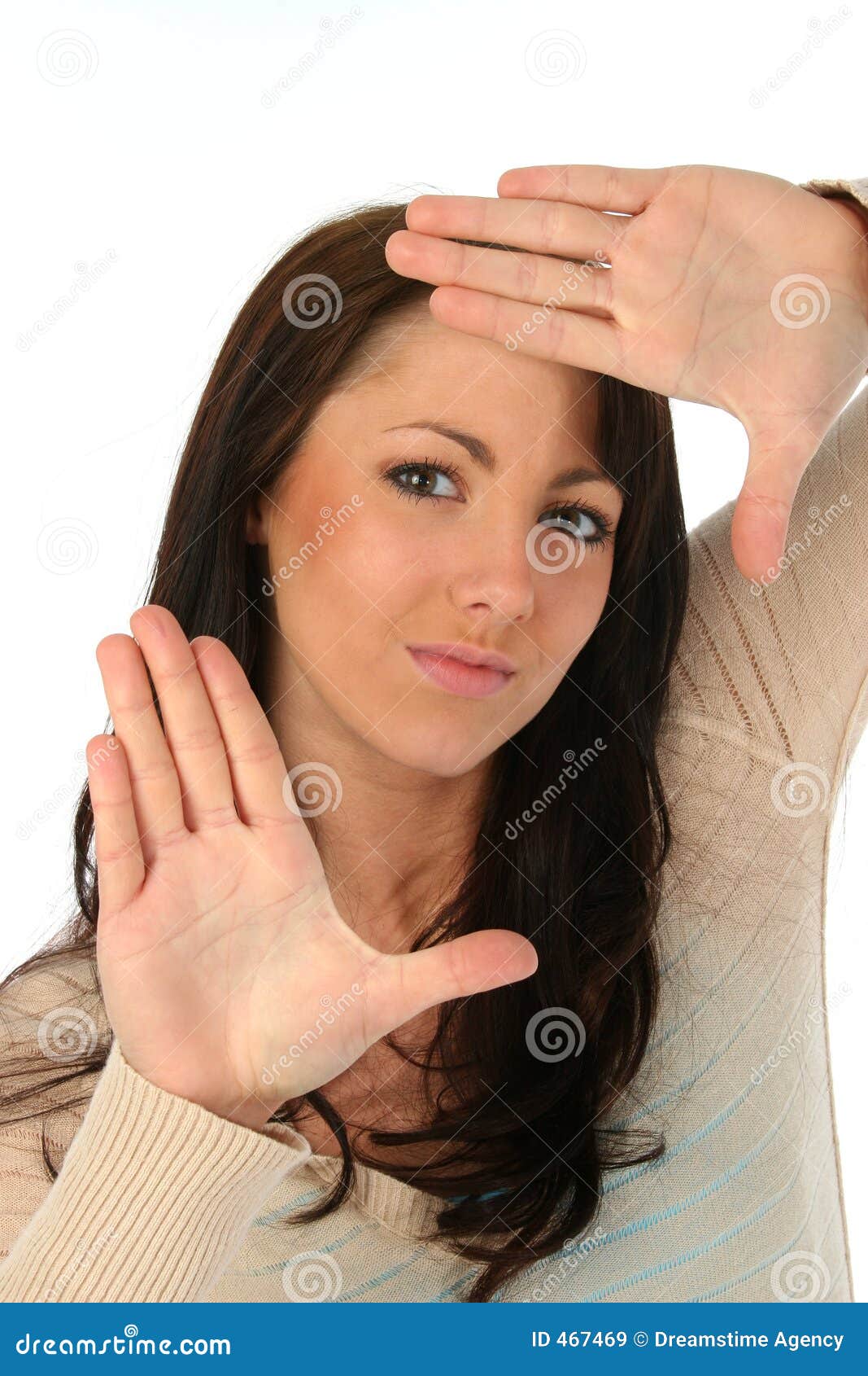 brunette woman framing face