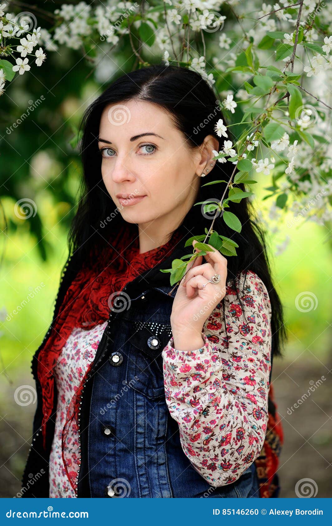 Brunette Woman with Long Hair Under Cherry Tree in Blossom Stock Photo ...