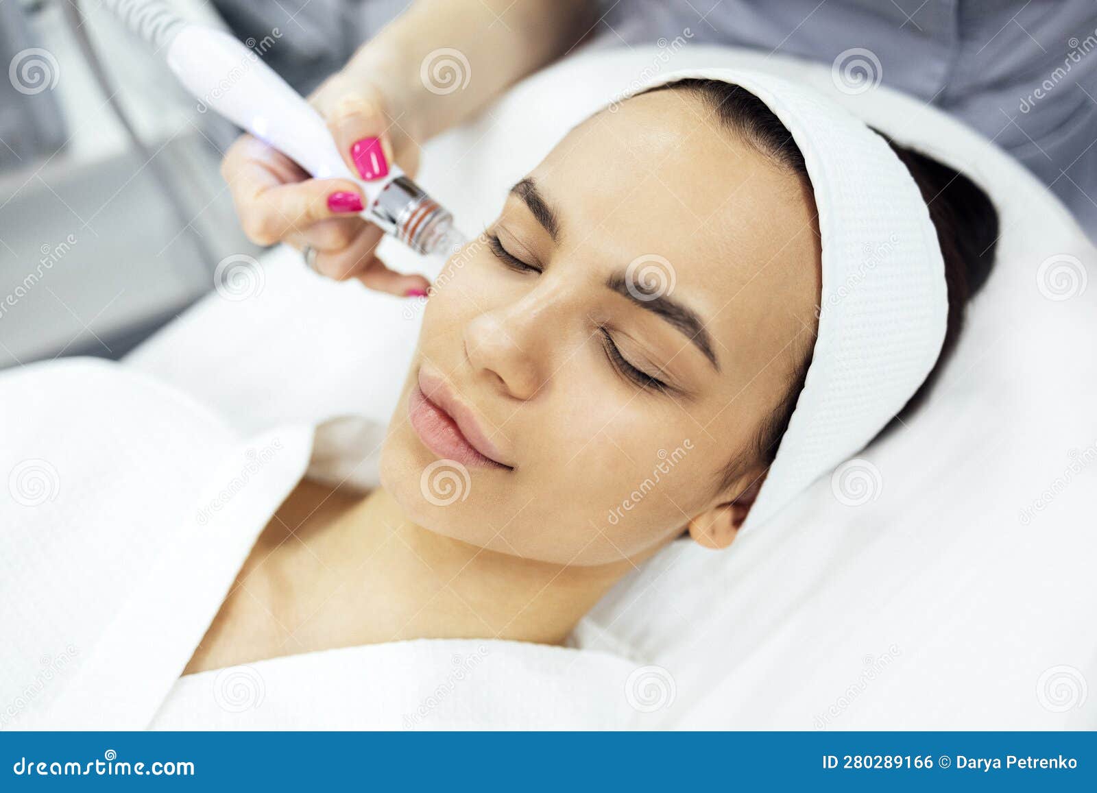 brunette young woman undergoes a procedure of vitamin peeling