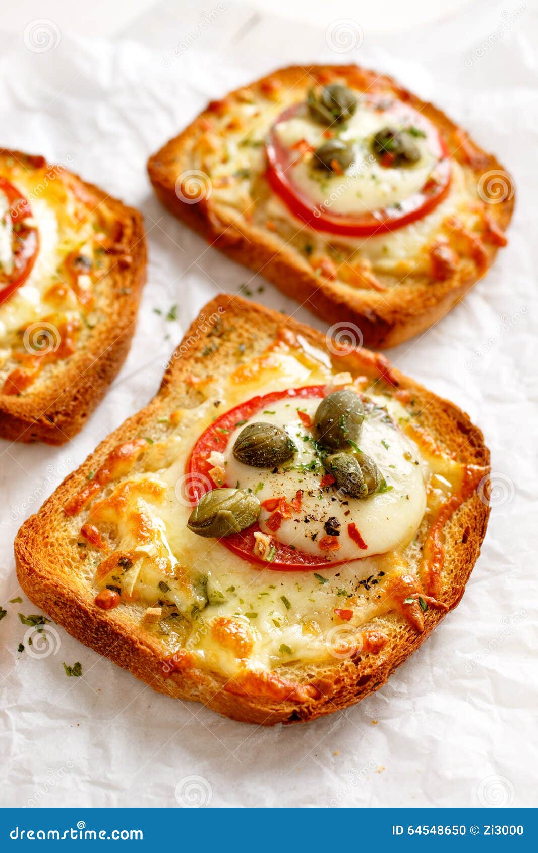 Bruschetta with Cheese, Tomatoes and Capers on a White Background Stock