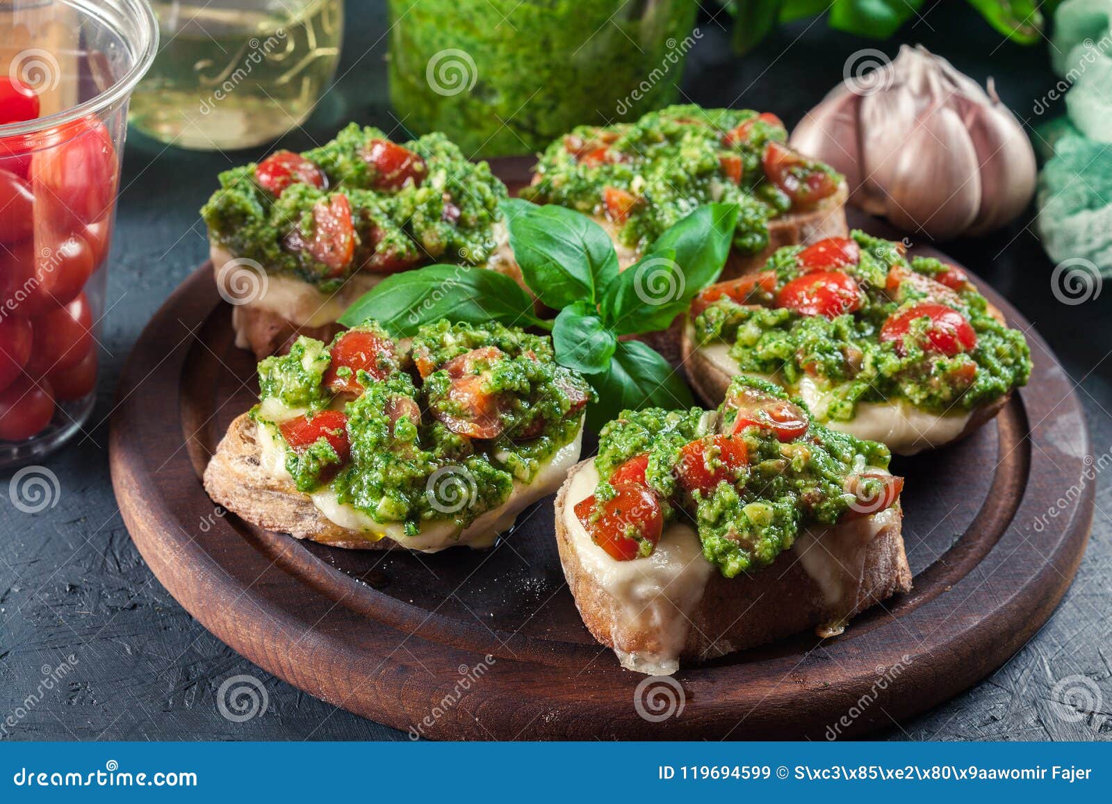 Bruschetta with Fresh Pesto, Mozzarella and Cherry Tomatoes on C Stock