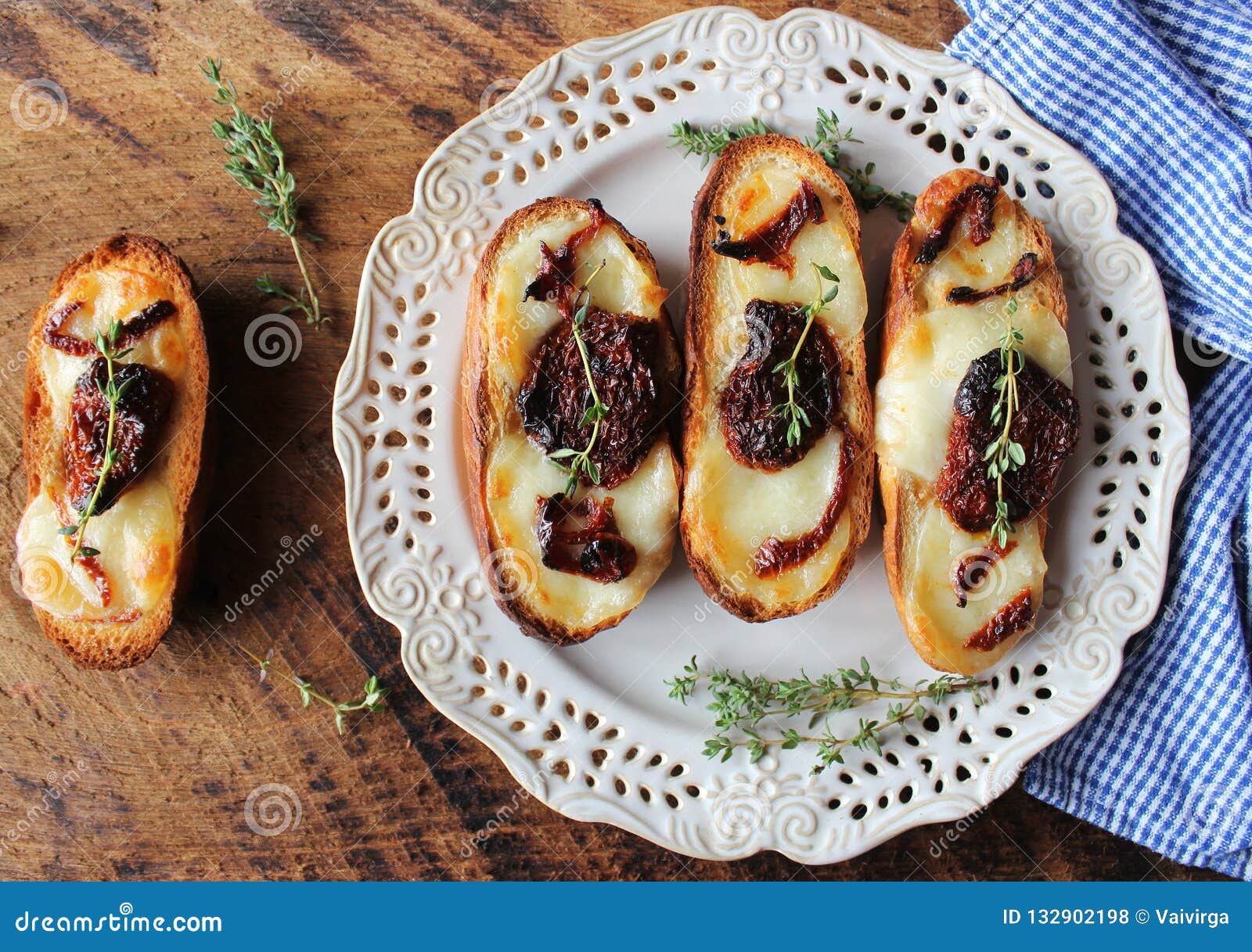 Bruschetta with Mozzarella, Sundried Tomatoes and Thyme Stock Photo