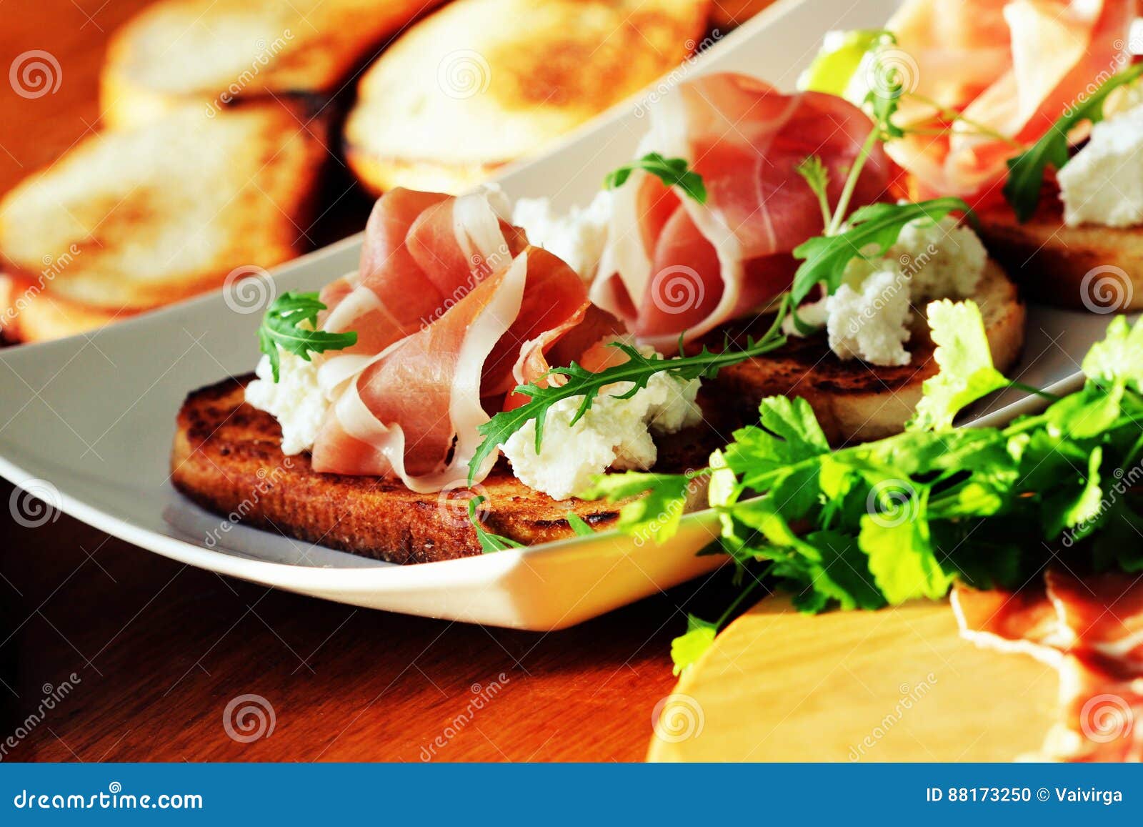 Bruschetta with Ricotta, Prosciutto, Rucola Stock Photo Image of