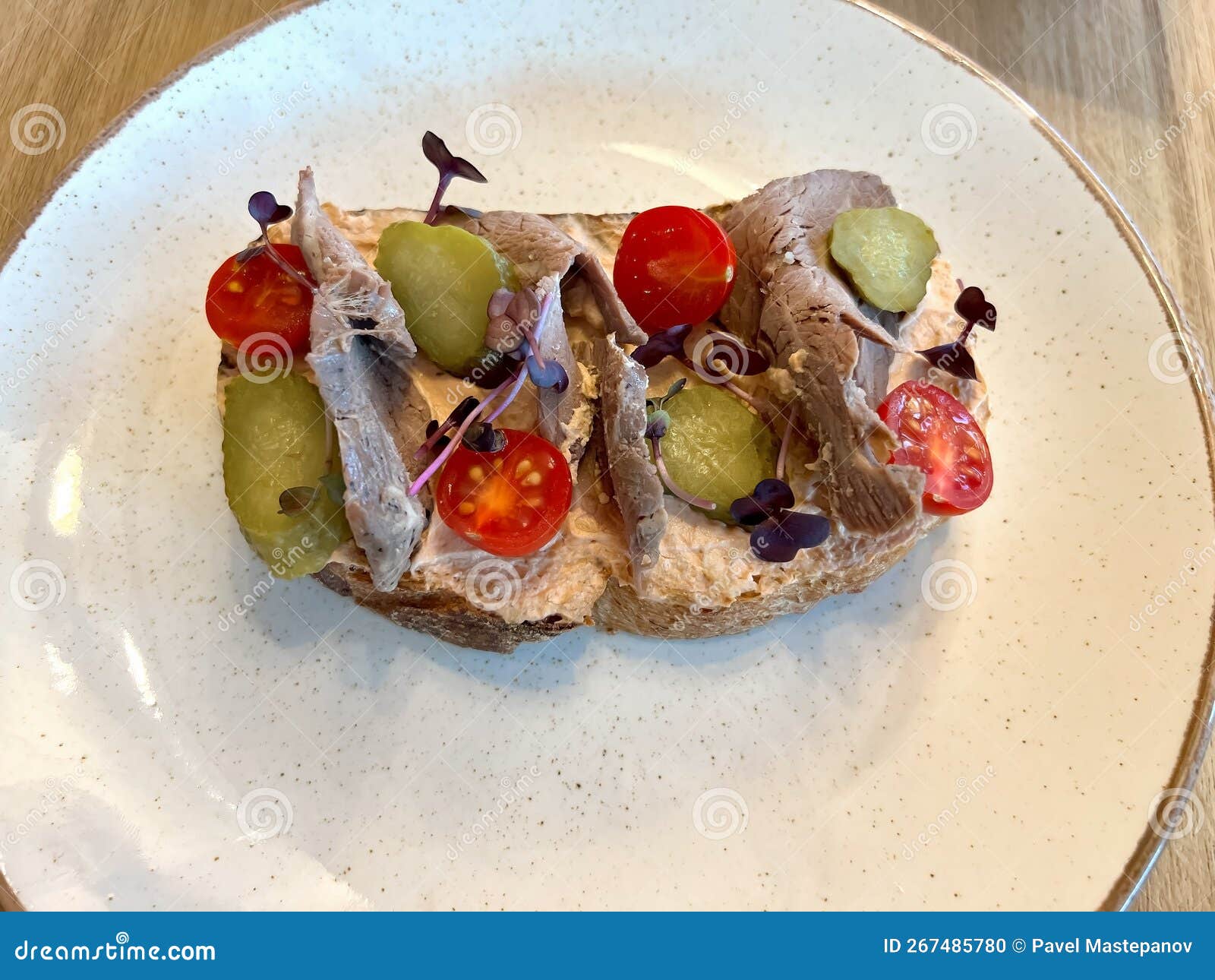 Bruschetta with Roast Beef, Vegetables and Microgreens Stock Photo