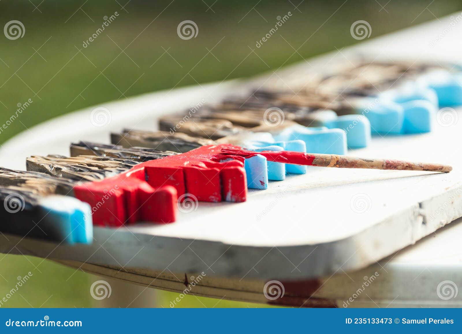 brush on a polystyrene surface on a table outdoors