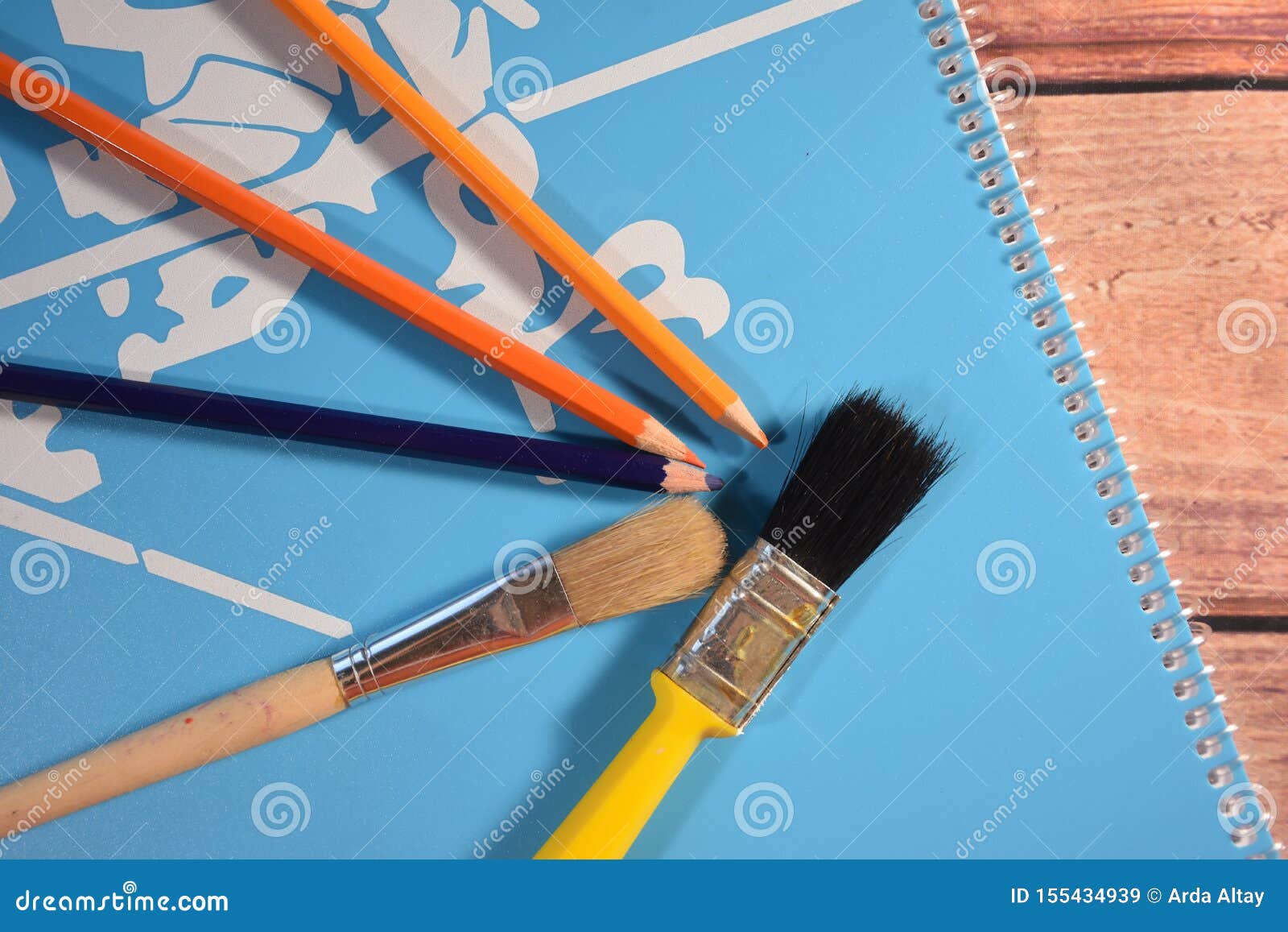 Brushes and Colored Pencils on Picture Book Stock Image Image of