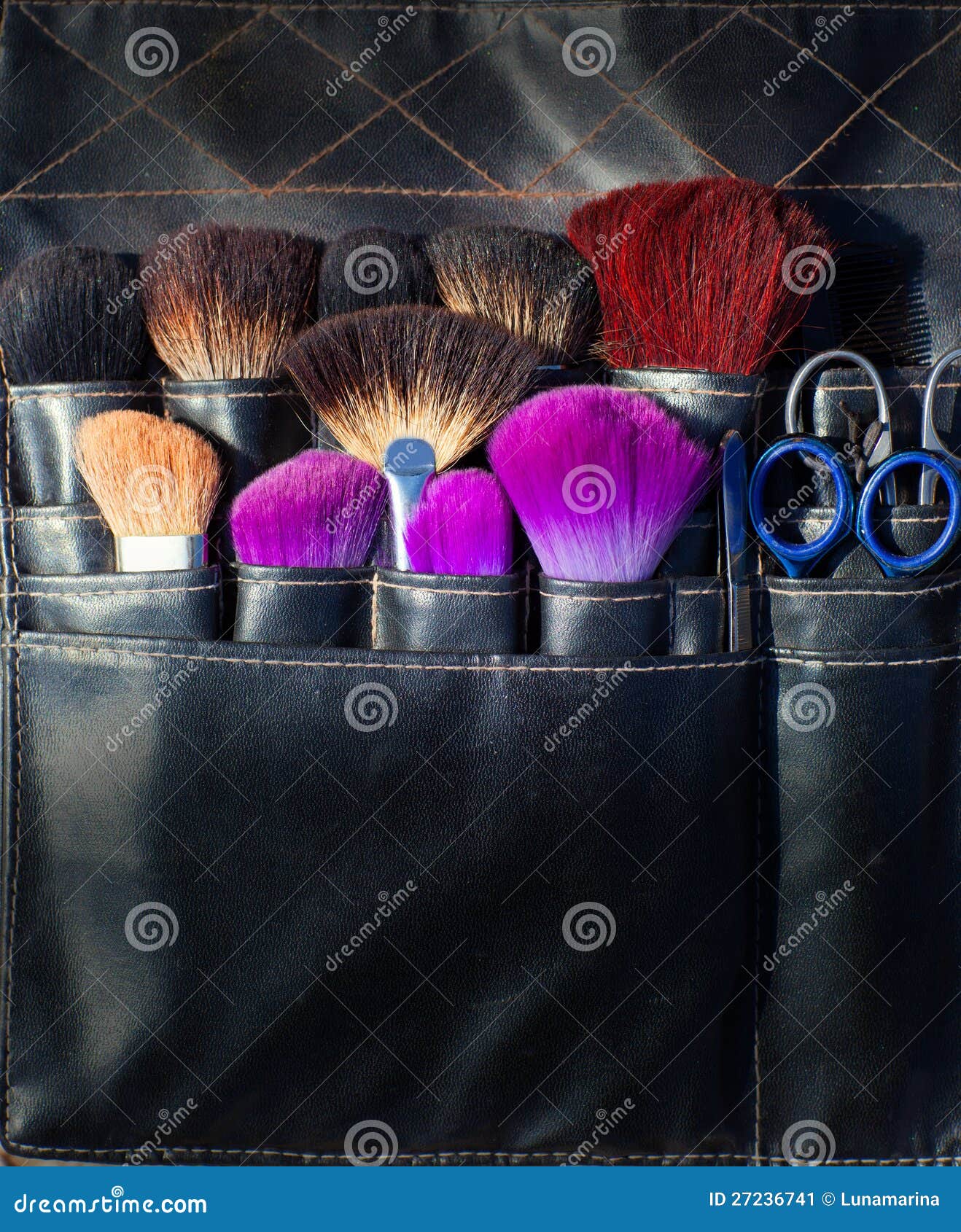 Brushes Scissors and Tools of Makeup Artist in Black Stock Image