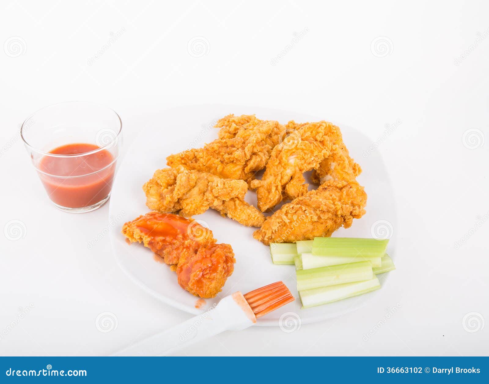 Brushing Hot Sauce on Chicken Strips Stock Photo Image of lunch