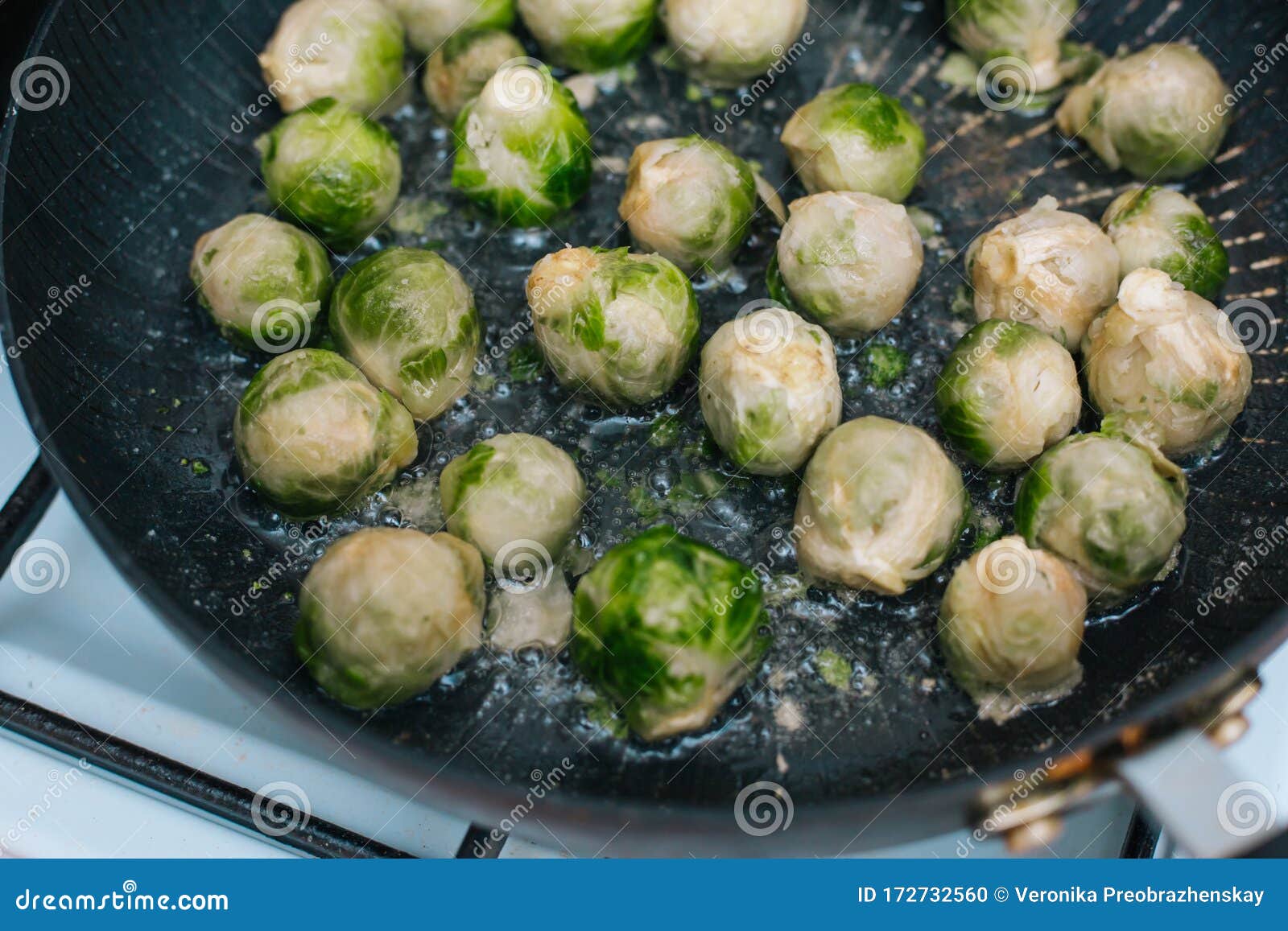 Brussels Sprouts in the Pan. Fried Cabbage in Butter Stock Photo