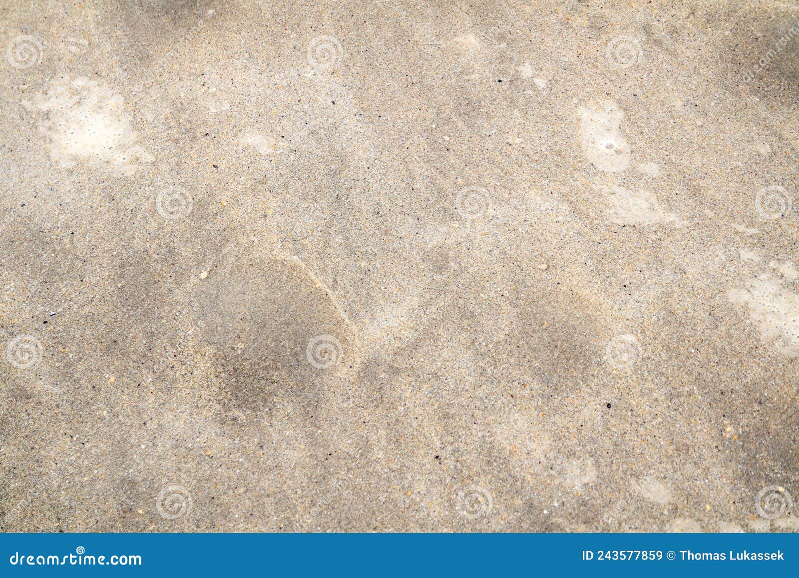 Bubbles in the Sand Showing that the Tide is Coming in Stock Image