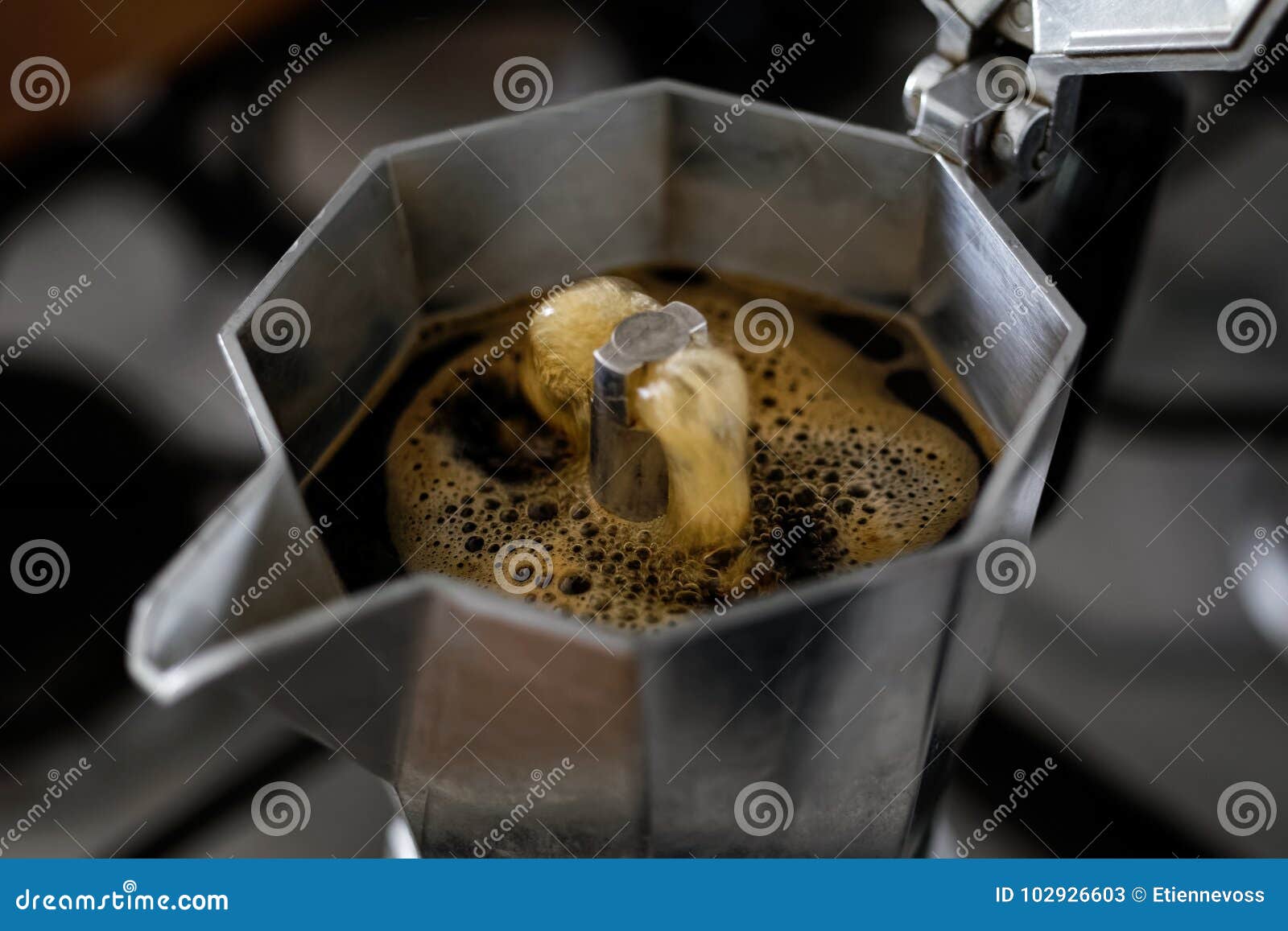 bubbling espresso coffee in a stovetop moka express.