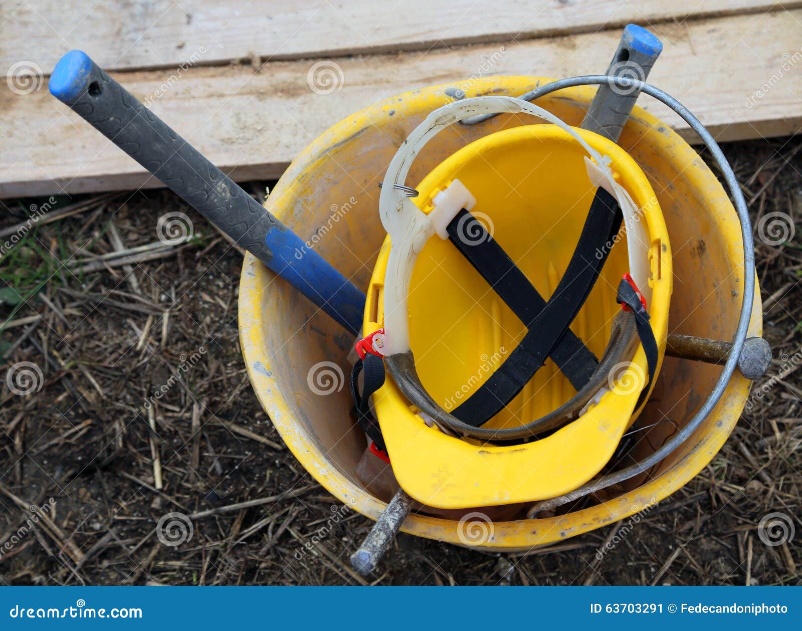 Bucket Builder with Yellow Helmet Stock Image Image of working