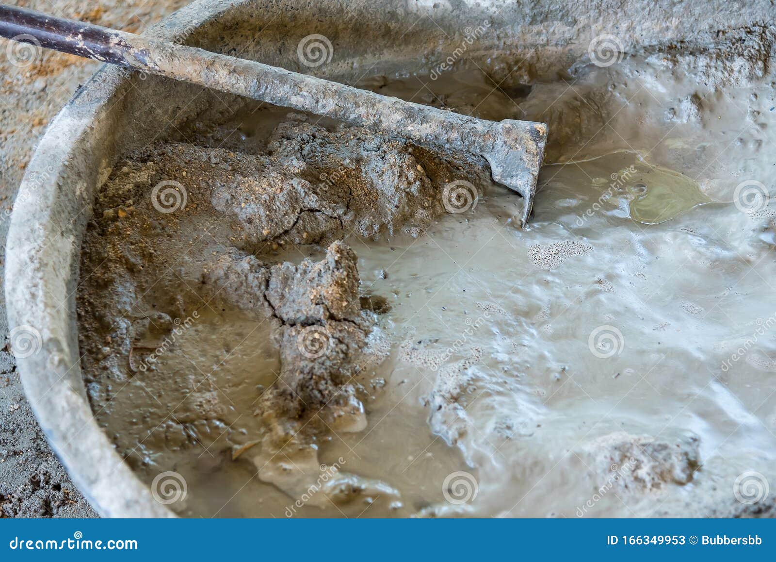 Bucket Cement Mix with on Construction Site the Ingredients. Brick