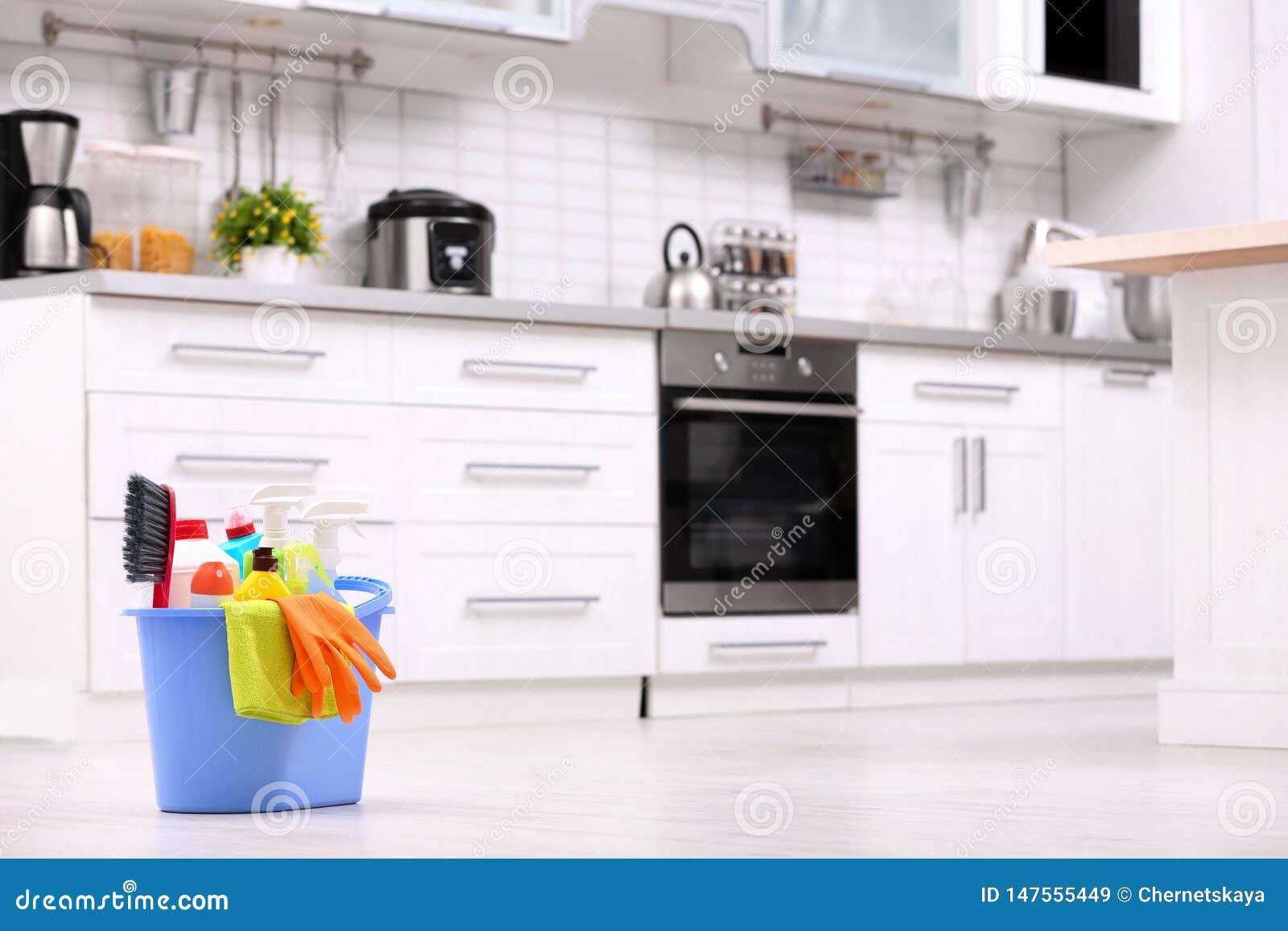 Bucket with Cleaning Supplies on Floor in Kitchen Stock Image Image