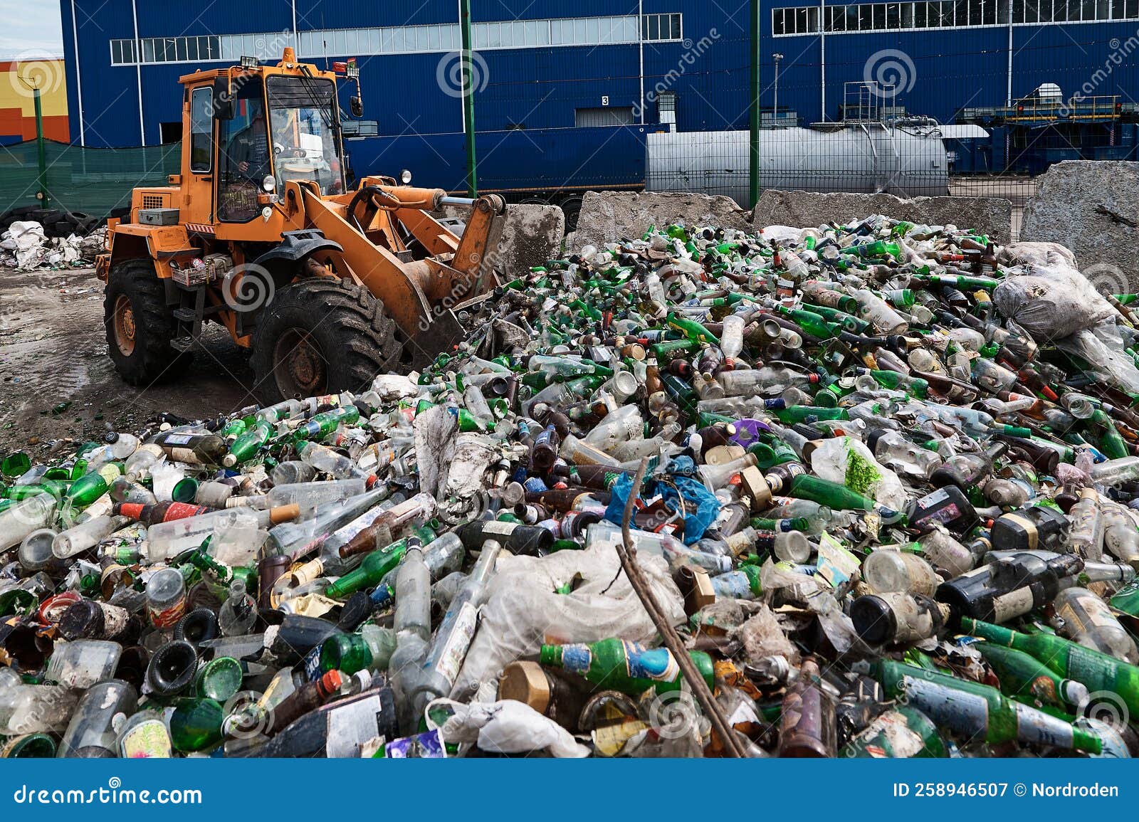 The Bucket Loader Breaks Glass Bottles by Dumping Them Out of the